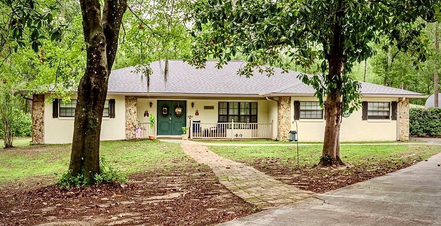 Tucked away on a quiet cul-de-sac in Rainbow Springs Woodlands, this charming home offers peace, privacy, and natural beauty — with deer visiting the yard almost daily. Notable updates include a new roof (2024), new AC (2023), and newer water heater (2019). Outdoor highlights feature a large 24x24 ventilated workshop, 12x10 garden shed, stone fire pit, gazebo, and a spacious enclosed Florida room perfect for relaxing or entertaining. Inside, enjoy custom built-ins, crown molding, a wood-burning fireplace, a beautifully remodeled master bath, and a large bonus room that could serve as a 4th bedroom, office, or flex space. The home is wired for solar and backup generator and includes high-speed Xfinity cable/internet. Residents enjoy exclusive access to Rainbow River Park with a private beach, kayak launch, clubhouse with bar & grill, pool, fitness center, tennis courts, and scenic walking trails. This home is a MUST SEE.