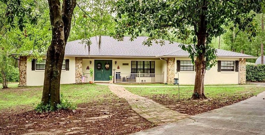 Tucked away on a quiet cul-de-sac in Rainbow Springs Woodlands, this charming home offers peace, privacy, and natural beauty — with deer visiting the yard almost daily. Notable updates include a new roof (2024), new AC (2023), and newer water heater (2019). Outdoor highlights feature a large 24x24 ventilated workshop, 12x10 garden shed, stone fire pit, gazebo, and a spacious enclosed Florida room perfect for relaxing or entertaining. Inside, enjoy custom built-ins, crown molding, a wood-burning fireplace, a beautifully remodeled master bath, and a large bonus room that could serve as a 4th bedroom, office, or flex space. The home is wired for solar and backup generator and includes high-speed Xfinity cable/internet. Residents enjoy exclusive access to Rainbow River Park with a private beach, kayak launch, clubhouse with bar & grill, pool, fitness center, tennis courts, and scenic walking trails. This home is a MUST SEE.