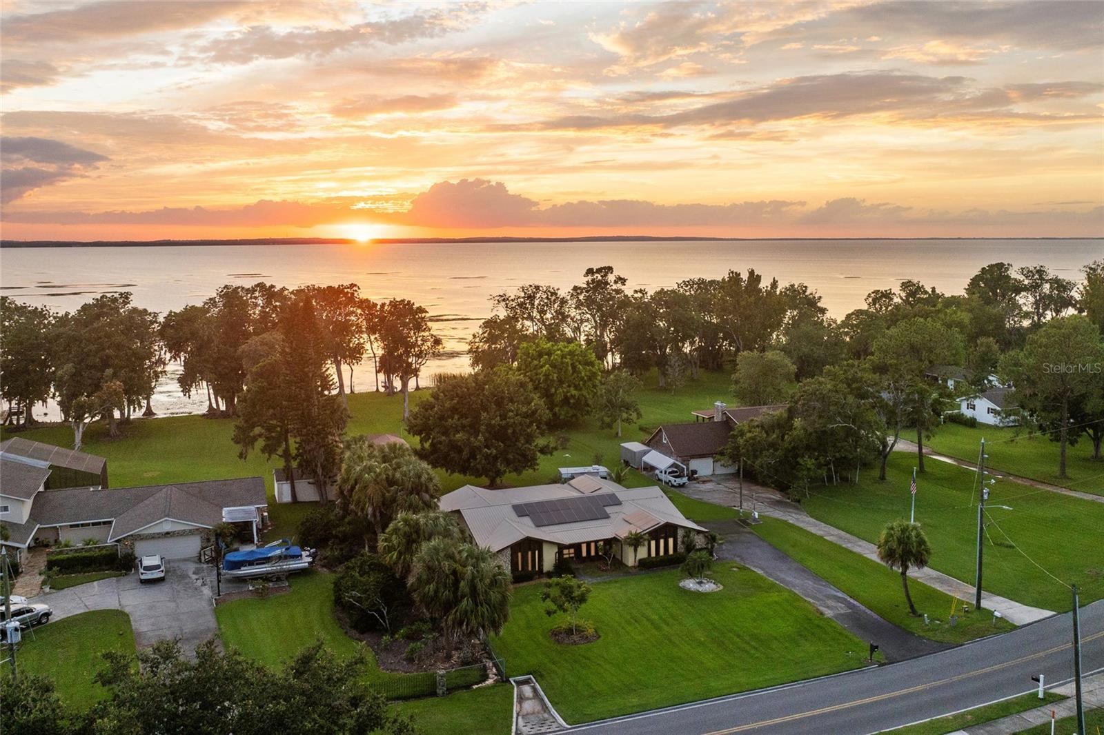 Welcome to 1507 N Fullers Cross Road, a rare lakefront opportunity on Lake Apopka.
This spacious three-bedroom, two-and-a-half-bathroom home sits on an impressive 1.12-acre lot with direct Lake Apopka frontage, offering privacy, tranquility, and year-round sunset views. Surrounded by mature trees and natural wildlife, the property provides a peaceful lakefront retreat while remaining close to everything Winter Garden has to offer.
Significant upgrades have already been made, including a newer metal roof less than five years old, full re-plumbing, mostly completed new electrical rough-in, and fully paid-off solar panels. The home is being sold in its current unfinished condition, giving buyers a unique opportunity to complete the residence to their own specifications and create a custom lakefront estate.
Construction was started and then paused. Electrical and plumbing rough-ins are mostly complete, with some finishing work still needed. No drywall has been installed, leaving a clean slate for buyers to design and finish to their own preferences. The seller will also convey valuable materials already on site, including various cabinets, quartz countertops, bathroom fixtures, and kitchen appliances—saving buyers time and upfront costs.
Whether you choose to complete the remodel, design a luxury lakefront retreat, or build a brand-new custom home, the potential of this Lake Apopka property is unmatched.
The location is exceptional. Just a short golf cart ride takes you to Historic Downtown Winter Garden, home to award-winning restaurants, a local brewery, live music, artisan eateries, museums, a theater, galleries, and boutique shopping. The nationally recognized Winter Garden Farmers Market and the 22-mile West Orange Trail for biking, walking, and running are also nearby. With easy access to major highways, area golf courses, and Orlando’s world-class attractions, this property combines lakefront lifestyle, convenience, and investment potential.
This Winter Garden lakefront home on Lake Apopka will not be completed by the seller prior to closing and is being offered as-is, providing a once-in-a-lifetime chance to own over an acre of prime Florida lakefront real estate with endless possibilities.
