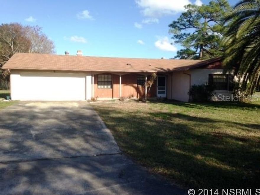 Enjoy the spacious enclosed back porch, large living room w/full wall fireplace, kitchen w/breakfast bar, 2 nice size bedrooms w/built in storage drawers, double garage,  block construction with wood accents, and centrally located close to shopping, dining, and entertainment.  This is a perfect home for retirees or would make a great starter home. ;Water: City