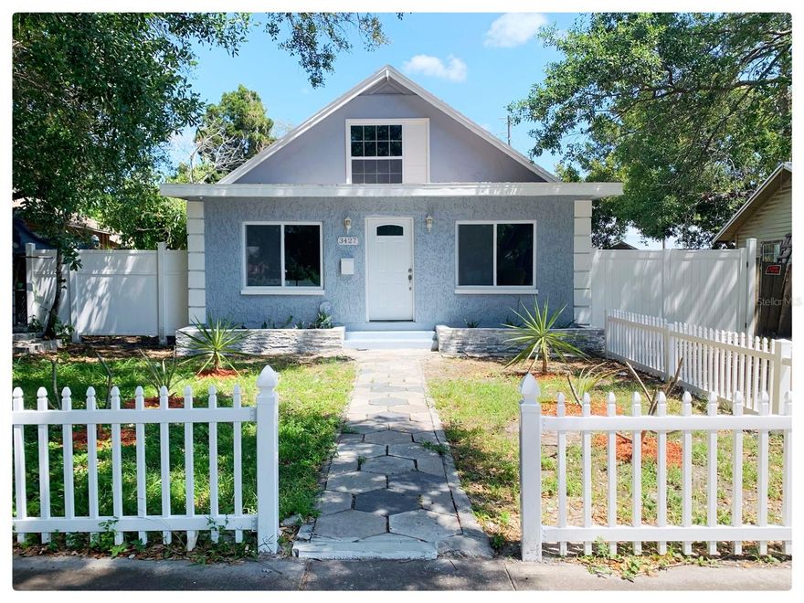 One or more photo(s) has been virtually staged. Experience modern luxury in this stunning, fully renovated (2025) home in the heart of St. Petersburg. This residence features a spacious open-concept living area and a designer kitchen complete with a large island and elegant stone accents. Significant high-ticket upgrades provide peace of mind, including a new roof (2021), a new A/C system (2021), and hurricane shutters installed in 2024. The expansive backyard is a private oasis, fully enclosed by a new fence (2026) and featuring a built-in fire pit perfect for outdoor entertaining. With 1,336 sq. ft. of living space and a gross area of 1,952 sq. ft., this turn-key property perfectly blends classic 1920s charm with contemporary convenience.