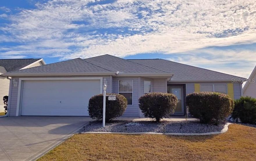 Location, location, location! Welcome to this well-maintained, 3-bedroom Wisteria model ideally situated in the highly desirable Bonita area. Major updates include a new water heater and a 2026 roof, plus NO bond. Water filtration system throughout the home. This home features a popular split floor plan with an eat-in kitchen and separate dining area, perfect for everyday living and entertaining. Enjoy relaxing in the enclosed, private lanai, offering additional living space and privacy. Luxury vinyl flooring runs throughout the home, complemented by volume ceilings that create a bright, open feel. Granite countertops in kitchen and both bathrooms.  The 2-car garage provides ample storage and convenience. Just a short golf cart ride to Lake Sumter Square, and minutes from Colony Shopping Center, Neighborhood Walmart, and Brownwood Paddock Square, with easy access to shopping, dining, and entertainment. FURNITURE IN THE LANAI AREA AND KITCHEN DINETTE SET DOES NOT CONVEY.