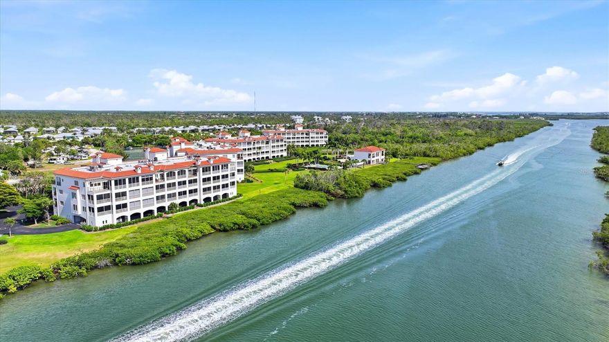 Beautiful fully furnished two bedroom 2.5 bath Hacienda residence in the prime waterfront "D" building.  Perched over the Intracoastal Waterway, enjoy breathtaking panoramic views of some of the most stunning waters in southwest Florida.  Expansive size and space in these properties, with nearly 1,700 sq.ft. under air, 1,986 total sq.ft., 10 foot ceilings, and 8 foot solid core doors, and large screened in lanais.  These properties are perfect for lounging, hosting overnight guests, and entertaining.  Stylish remodel offers an updated kitchen with tremendous counter space and stunning honed soapstone surface, tile backsplash, premium plumbing fixtures and appliances.  Tile throughout the living areas and engineered wood in the bedrooms.  All Andersen Coastal Series impact resistant windows and sliders, plus hurricane storm screen on the lanai for added peace of mind.  The expansive outdoor living area is enhanced further with a fully equipped outdoor kitchen.  The move-in ready property comes complete with nearly new elegant coastal inspired furnishings and decor.  Positioned in the middle of the Hacienda community, the "D" building is equal distance to the two resort style swimming pools and spa, and to the boat basin.  Endless first-class amenities include a signature waterfront clubhouse, stunning pool area, fitness center, tennis and pickle ball courts, outstanding fenced dog park, boat basin and 23 acres of refined tropical landscaping with meandering paver sidewalks.  Close to three marinas, public and private golf courses, Palm Island and Boca Grande beaches, essential shopping, superb restaurants, and world-class fishing and boating.