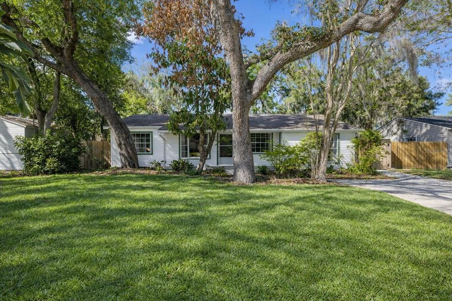 NO HOA with a peaceful retreat setting. Located just minutes from Seminole Heights and Downtown Tampa, this thoughtfully updated 3 bedroom, 2 bath home offers modern comfort with a layout designed for today’s lifestyle. Renovated in 2021, the interior features a clean, contemporary feel, complemented by a newer HVAC system, updated electrical panel, and a new well pump. The flexible floor plan provides multiple living areas ideal for gathering, working from home, or creating dedicated spaces. Just off the primary bedroom, a glass enclosed, air conditioned retreat serves perfectly as a home office, lounge, or wellness space. The spacious fenced backyard features mature trees, irrigation, and two storage sheds, offering both functionality and room to expand. A double gate opens to a covered carport located on the side of the home, with additional driveway parking available in the front. Positioned near ZooTampa at Lowry Park, local restaurants, coffee shops, and breweries, this home places you in one of Tampa’s most vibrant and established neighborhoods. Available to show every day, schedule your private showing now.