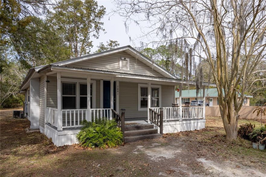 PRICED TO SELL! Charming 3-bedroom, 1-bath cottage situated on a spacious 0.39-acre corner lot within city limits. This solid home offers a great layout featuring a living room, separate dining room, and dedicated laundry room. Enjoy relaxing mornings on the covered front porch and the peace of mind of a metal roof, vinyl siding, and newer AC and Water Heater. With great bones and plenty of character, this property offers an excellent opportunity to add your personal touches while living comfortably in the home. The price reflects minor cosmetic updates needed, making it a smart option for buyers looking to build equity. Experience the feel of country-style living with the convenience of being close to town. Cute, functional, and full of potential — come see the possibilities!