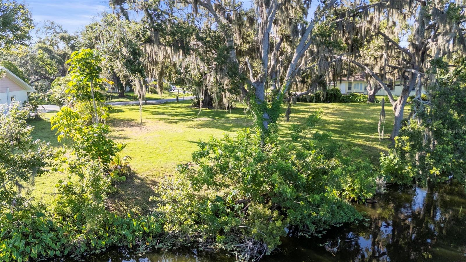 Build Your Dream Home in Desoto Lakes
This rare 0.27-acre waterfront lot in the desirable Desoto Lakes community offers 170 feet of scenic shoreline on Desoto Lakes. With NO DEED RESTRICTIONS and access to public water and sewer, this property is a blank canvas for your custom-designed home.
Enjoy privacy, stunning water views, and the unique charm of this sought-after Florida neighborhood. Sarasota County’s improvements, including relocating power lines underground, will enhance both resilience and aesthetics.
Conveniently located near shopping, dining, UTC mall, Downtown Sarasota, and SRQ airport, with nearby parks offering outdoor recreation. Plus, the sellers have a permit to remove an existing Oak tree, readying the lot for your dream home. Don’t miss this rare opportunity to create your perfect lifestyle in Desoto Lakes!