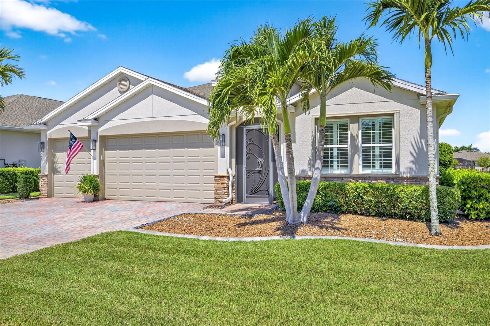 Elegant Upgrades & Lakefront Living in the Gated community of Entrada. Welcome to the most captivating Destin floorplan model in the sought-after gated community of Entrada—an exceptional residence that truly stands apart. Thoughtfully upgraded and impeccably maintained, this home IS elegance, comfort, and modern sophistication. Step into this spacious 3 bedroom + a den oasis loaded with upgrades. Sweeping Tray ceilings with cove mouldings in the main living area welcome you into the inviting space. The completely remodeled and spacious gourmet kitchen (with enlarged island) is simply stunning, showcasing high-end Corian marble-look countertops, custom cabinetry, double ovens, Radiant Cooktop, a built-in wine refrigerator, extended cabinetry, full height backsplash, upgraded stainless steel appliances, built in Breakfast TV above microwave and designer lighting. This open-concept design is anchored by beautiful tile flooring throughout, creating a seamless flow from room to room. The spacious and light-filled interior includes a stunning custom-built floating wall entertainment unit in the great room complete with custom recessed lighting. Plantation shutters and custom window shades adorn each widow including the sliding doors—adding both charm and functionality. Custom closet cabinets/shelving in the bedrooms creates organization and appeal. The master bathroom ensuite features upgraded dual vanities with vanity tower cabinet and an oversized custom-tiled shower with glass tile cut-ins and glass shower door. Both guest bathrooms highlight upgraded glass shower doors and tiled showers as well as marble-look Corian countertops with molded vanity sinks. Step outside to your private oasis—an exceptionally large extended paver lanai with atrium screen overlooking the tranquil lake and fountain, complete with your own personal hot tub, ideal for entertaining or quiet relaxation. Additional features on this already stunning home include a New roof (2023), an ample 3-car garage with epoxy flooring, an added garage sink, overhead storage racks and metal shelving. Outside you'll find added peace of mind with accordion hurricane shutters at all windows, Motorized roll-down shutters for the front porch and lanai, and a generator with an LCEC Generlink plug. This is more than just a home—IT'S A SHOWPLACE! With every upgrade imaginable and impeccable attention to detail, this is your opportunity to own the prettiest house on the block in one of Southwest Florida’s most popular pet and golf cart friendly communities with resort style amenities, low HOA fees and underground utilities plus NO FLOOD zone makes this dream home STAND OUT! Schedule your showing on this showplace today!