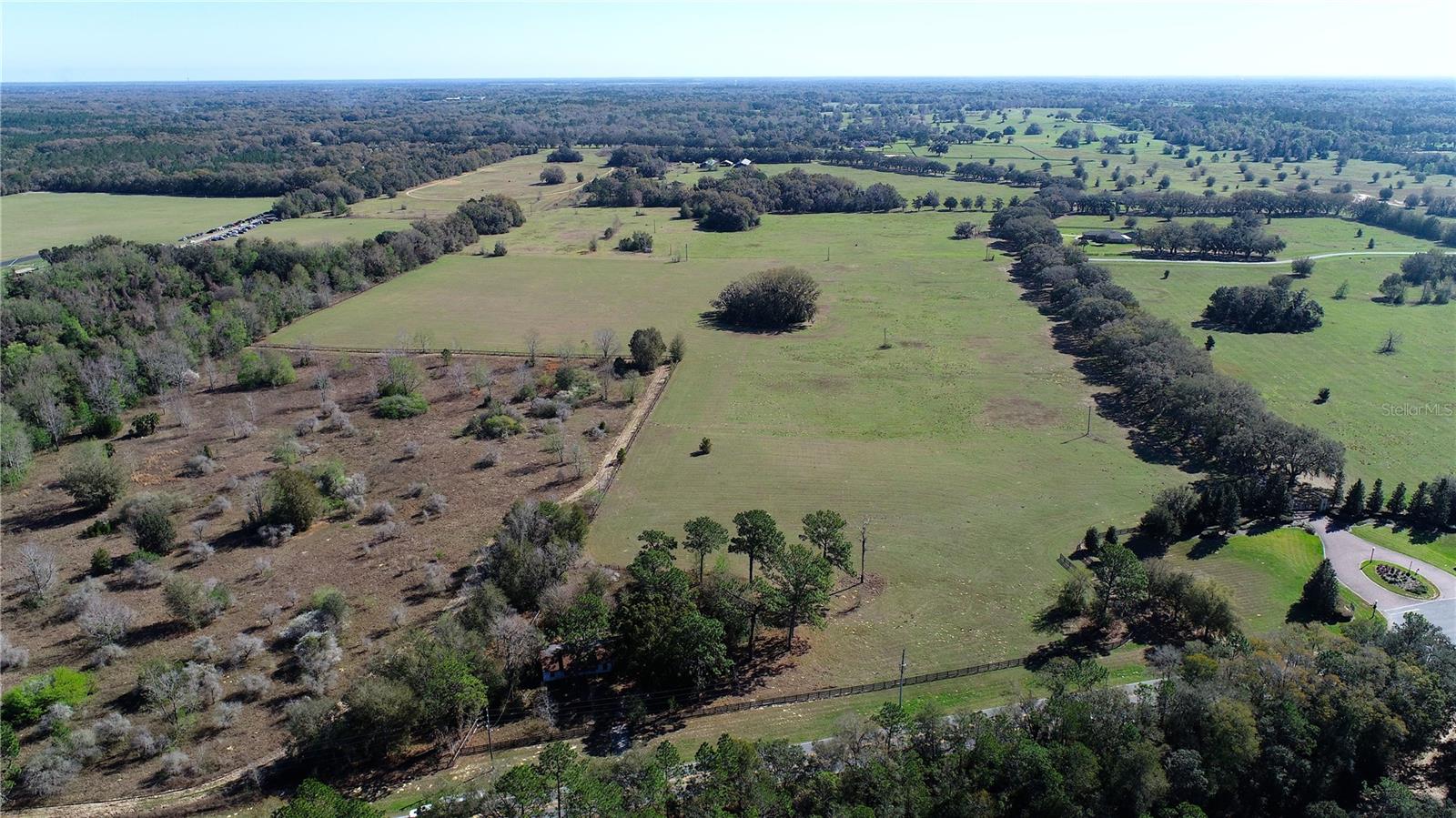 Via Paradisus is a prestigious gated equine community that offers an unmatched atmosphere for equine enthusiasts. Via Paradisus is conveniently located across from the Florida Horse Park, has access to the Florida Greenways and Trails, and is only minutes from the I-75. This property would make a beautiful estate horse farm of choice or could be developed. The property features gently rolling hills and majestic oaks with tree-canopied drives and adjoins the Marjorie Harris Carr Cross Florida Greenway, which offers miles of trails for hiking, biking, or horseback riding with pure relaxing enjoyment. Call today for additional information.