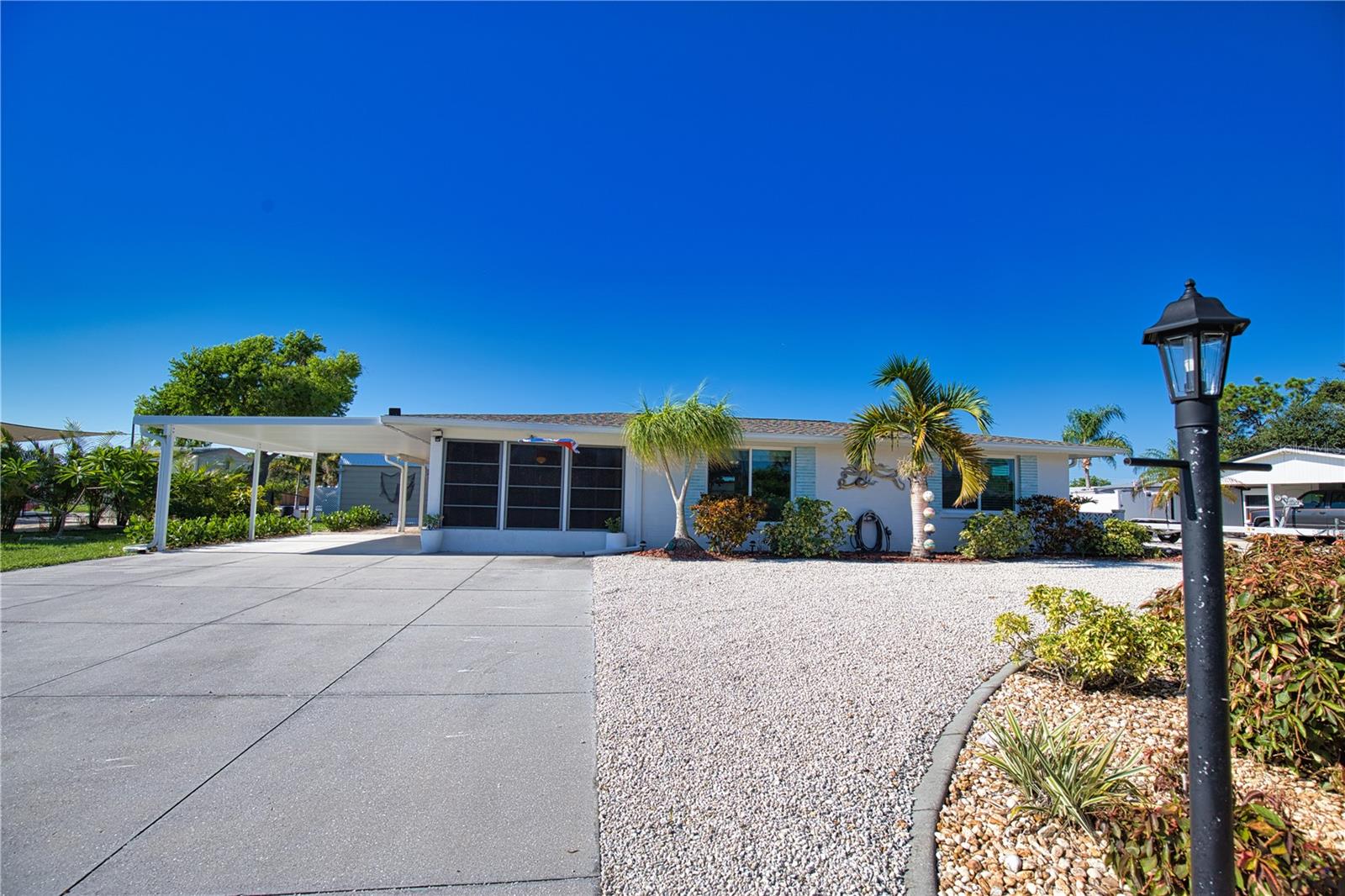 New Listing – Gulf Access Canal Home with Heated Pool! Welcome to your Florida oasis! This charming 2-bedroom, 1-bath home features a bright Florida room, perfect for relaxing or entertaining. Inside, you’ll find granite countertops, upgraded appliances, and a 2-year-old roof, combining modern updates with peace of mind. Step outside to your private heated pool and enjoy the ultimate indoor/outdoor lifestyle.
Located on a canal with direct Gulf access, the property includes a boat lift, making it ideal for boaters and water lovers. With no flood damage, this home is truly move-in ready. Whether you’re seeking a full-time residence, vacation getaway, or investment property, this home has it all—