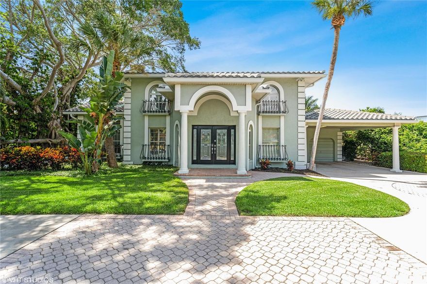 Paradise lost has now been found! Welcome to this landmark property in Bath Club Estates. Open water, mature landscaping, and architectural privacy walls surround this stunning home. Situated on one and a half lots, this 1/3 plus acre property is an oasis unmatched. It provides the owner with peace and privacy that turns with ease to grand entertaining on land and water. You will not find this combination elsewhere. This custom home occupies a corner lot with 80 feet of open water frontage. The main level remodel was completed in 2018. Entering the foyer, you will notice high ceilings and a grand staircase. Cool porcelain tile and sleek design unite the open plan layout, with fireplaces and the tropical Florida landscape providing warm counterpoint. A 13 foot quartz island forms the heart of the chef-designed kitchen, which further features a gas cooktop with wok burner, double oven and a layout meticulously planned for convenience and entertaining. The kitchen also boasts a butler's pantry with service entrance, prep sink, and an area for a second dishwasher. The home’s uncluttered aesthetic continues into the immense 35’ by 15’ living area. Flexible seating possibilities, stunning tropical and water views, and a retractable screen projection AV system stage this stunning space for large family get togethers and intimate, peaceful enjoyment. From the living area you enter the sky lit, double height formal dining room. Diners can enjoy the fireplace with nature views on three sides, and a wall of windows framing the living art of the property's storied Banyan tree. 2 sets of French doors lead to the covered lanai, firepit, pool, composite dock (new in 2019) and the Intracoastal waterway beyond. Along the east side of the home on the main level there is a guest suite with walk-in closet and en-suite bath. Finishing off the main level is a cabana bath, 4 entry points to the outdoor oasis and an oversized 2 car garage and covered carport. Upstairs you'll fall in love with the walls of windows and fireplace in your immense owner's retreat. Rich wood flooring compliments the lush tropical views. The owner's bath features a walk-in closet, jetted 6’ x 4’ garden tub, Roman shower, water closet, dual vanities and a dressing/makeup area with a third vanity. Attached to the owner's space is a 13' by 13' sitting area with ingress/egress that could be easily converted to a 4th bedroom. Off of the sitting area are two outdoor decks, one with a spiral staircase leading to the pool. Rounding out the upstairs is a large guest bedroom, guest bath and laundry room. The extensive windows and skylights throughout the home keep the spaces light and bright. The tile roof was replaced in 2017, HVAC system in 2016 and gas whole house water heater in 2017. The oversized 40’ by 22’ pool is designed for lap swimming/exercise, swim parties and as the perfect perch for enjoying our stunning sunsets from the built in seating area. It has a new filtration system and automatic pool cleaner. The paver pool deck has multiple lounging areas and a firepit space for parties, relaxed contemplation or s'mores! As you meander out onto the large composite dock you'll see multiple levels for extra seating and launching kayaks and paddleboards along with a 10,000 lb. boat lift. Steps from the beach, restaurants, tennis courts, pickleball courts and a playground, this tropical oasis is truly one of a kind. Room Feature: Linen Closet In Bath (Primary Bathroom).