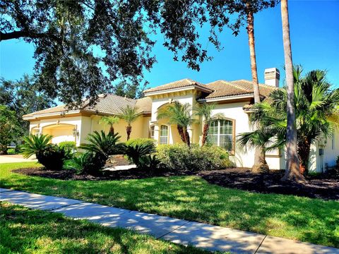 Photo of 10004 Tree Tops Lake Road, Tampa, FL 33626 (MLS # TB8420393)