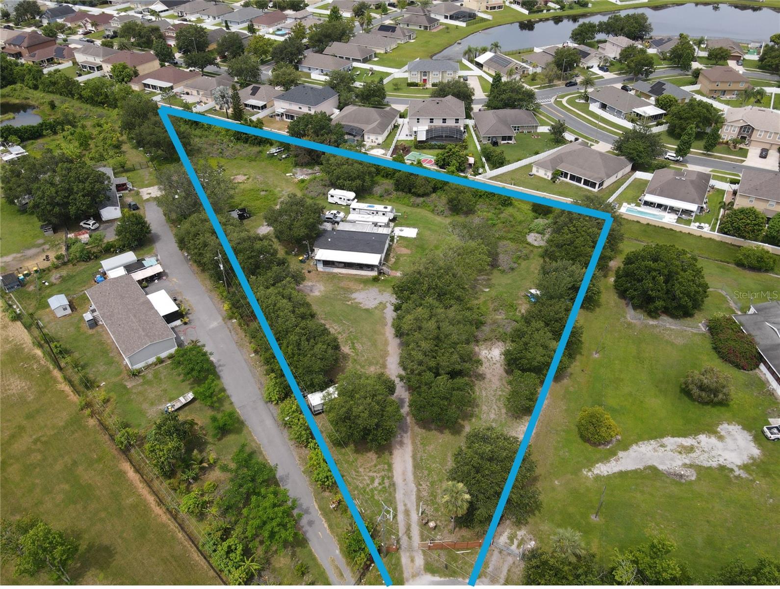 LOCATION, LOCATION, LOCATION! A Rare Industrial Development Opportunity in Booming Lake Nona area! This rare parcel at almost 2 acres in size unlocks exceptional potential and the property is situated in one of Kissimmee’s most rapidly growing areas. This piece of land has an ideal blend of privacy, peace, and potential. It is a perfect suit for forward-thinking investors and developers as the property is currently zoned for OAC (Open Agriculture and Conversation) and it can transition to Future Land Use (FLU) as Industrial. There is TOTAL FREEDOM with NO HOA restrictions: bring your RVs, boats, storage units, and all your favorite toys ensuring yourself with future development flexibility. Whether you’re looking to entertain, relax, or start your own mini farm, this property has the space and versatility to do it all. Strategically located near key infrastructure including Orlando International Airport, Lake Nona Medical City, Kissimmee’s tourism hotspots, and major highways, this parcel offers both logistical advantage and long-term growth potential. Enjoy the tranquility of rural living without sacrificing convenience. Don’t wait—schedule your private showing today and fall in love with this one-of-a-kind property! This rare gem won’t last long. Come live the life you’ve always imagined, free, connected to nature, and full of possibility. Don’t miss your chance to be part of Central Florida’s next major industrial hub.
