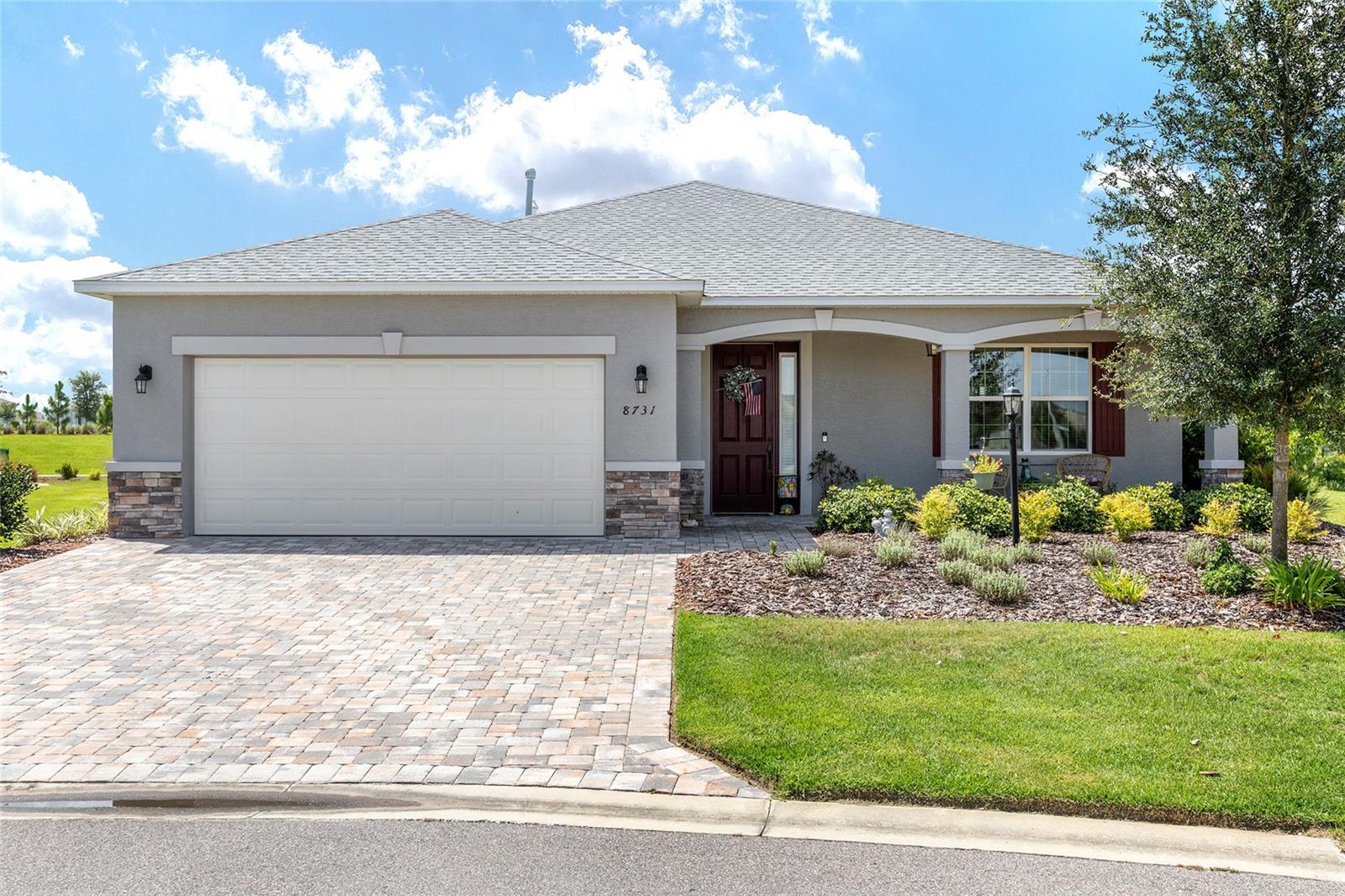 This beautifully upgraded Wisteria model, built in 2021, is nestled in the highly desirable On Top of the World Golf, a 55+ Community within Weybourne Landing. Designed with both style and functionality in mind, the home features tile flooring throughout the main living areas and bathrooms, plush carpeting in the bedrooms, and elegant custom lighting.
The gourmet kitchen is a standout, offering a large L-shaped island, granite countertops, 42" maple cabinets with soft-close drawers, under-cabinet lighting, a stylish tile backsplash, and a spacious walk-in pantry. It’s equipped with upgraded appliances, including a gas cooktop, built-in microwave and oven, refrigerator, dishwasher, and washer and dryer.
An extended foyer welcomes you into an open-concept floor plan, showcasing picturesque views of the kitchen, dining area, and expansive great room highlighted by a charming stone fireplace. Smart home technology adds modern convenience and hands-free control throughout.
The spacious primary suite offers two walk-in closets and a spa-like bathroom featuring a walk-in shower with glass enclosure. Outdoors, the extended paver patio runs the length of the home — perfect for entertaining, relaxing, and grilling.
Additional features include stacked stone exterior accents, a two-car garage, paver driveway and front porch, a gas water heater, water softener, and a full-home water purification system. The property also benefits from an irrigation system and HOA-covered services such as curbside mail and trash pickup.
Residents of Weybourne Landing enjoy access to top-tier amenities, including a resort-style pool, fitness center, pickleball courts, dog park, clubhouse, mini-golf, and an outdoor pavilion with BBQ grills. Ideally located near the community’s cultural center, this home offers golf cart access to nearby grocery stores, restaurants, and medical facilities.
Schedule your private showing today to enjoy everything this exceptional home and community feature!