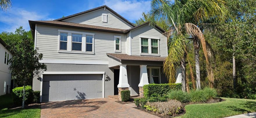 An exceptional opportunity awaits with this spacious two-story home in the highly sought-after Stafford Place community of Tampa Palms. Home is centrally located and is few minutes away from I-75, Tampa Premium Outlet Mall, fine dining, theaters, lots of shops, family entertainment, BJs, Costco, and 5 minutes from University of South Florida. Few minutes from New Tampa Recreation Center with a playground, dog park, and a skate park. Home offers a three-car tandem garage, providing ample space to park and use it as a storage. As you step into the home, you are welcomed by a foyer and on the right a formal dining room, which can also be used as a front office. The dining room conveniently connects to the kitchen through a butler’s pantry. The kitchen features granite countertops, shaker-style cabinetry, and a large walk-in pantry. A spacious island with seating and a cozy dinette area overlook the expansive family room, creating an ideal space for everyday living and entertaining. On the main floor, you’ll find an additional laundry room, a half bathroom, and the primary bedroom suite featuring a spacious ensuite bathroom and a walk-in closet. The covered, screened-in lanai provides the perfect place to relax while enjoying beautiful conservation views. The backyard features steps leading to a thoughtfully designed paver courtyard with a stone fire pit and ample seating—ideal for enjoying the peaceful natural surroundings. The yard is fully enclosed with black aluminum fencing. Upstairs, the home offers four additional bedrooms, two bathrooms, and a main laundry room. A large bonus room provides the perfect space for a play area, media room, or family entertainment. Don’t miss the opportunity to call it as your home!!!