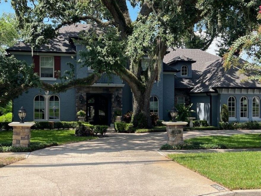 Custom home situated on Spring Lake within the gates of Country Club of Orlando. Over 4200 square feet of living with spacious living areas and beautiful views.