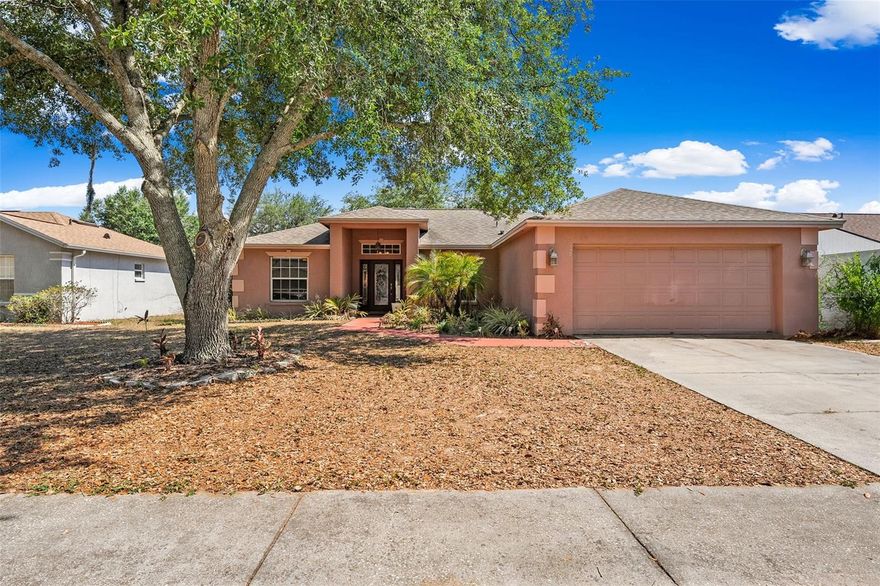 Welcome to this well maintained 3-bedroom, 2-bathroom, 2-car garage home located in the quiet charming community of Winston Manor featuring LOW HOA fees and NO CDD. Major upgrades and improvements provide exceptional value and peace of mind, including a NEW ROOF (2021), NEW TANKLESS WATER HEATER (2025), NEW CLACK WATER SOFTENER SYSTEM (2025), fresh exterior paint (2021), NEW VINYL PRIVACY FENCE (2021), updated flooring (2020), newer appliances (2018), HVAC replacement (2015), and a water filtration system. Pride of ownership is evident throughout every detail of this move-in-ready home. Inside, you’re welcomed by an inviting foyer leading into the spacious living room featuring soaring vaulted ceilings and sliding glass doors opening to the covered and screened lanai, creating a charming indoor-outdoor living experience perfect for entertaining or relaxing Florida evenings. The formal dining area showcases elegant chair rail molding, decorative ceiling details, and a beautiful chandelier, while the bright galley-style kitchen offers abundant cabinet storage, stainless steel appliances, a closet pantry, breakfast nook, and a sunlit bay window that fills the space with natural light. The private primary suite serves as a relaxing retreat featuring a spacious walk-in closet with custom wood organizers and an ensuite bathroom complete with dual vanities, a garden tub, and separate tiled shower. The split-bedroom floorplan provides added privacy, while luxury vinyl flooring throughout the main living areas combines durability with modern style. Step outside to your quiet fully fenced backyard oasis featuring a large screened patio with dual outdoor ceiling fans and plenty of space for pets! Additional features include a security system, in-wall pest control tubing, crown molding accents, wood-framed mirrors, and thoughtful upgrades throughout. Perfectly positioned with quick access to I-4, I-75, and SR-60, this home offers convenient commuting to Downtown Tampa, Brandon, Lakeland, shopping, dining, entertainment, grocery stores, parks, and highly rated schools, all within approximately 5–15 minutes, while Tampa International Airport and Downtown Tampa are both within approximately 25–35 minutes. This home offers the perfect combination of comfort, functionality, upgrades, and location all in a quiet, well-maintained community. Schedule your private showing today.