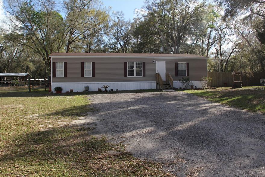 Package deal opportunity! Discover the possibilities with this unique agricultural 6.7-acre property in Brooksville, featuring two manufactured homes with two separate property addresses, situated on the same parcel, with the land included in the sale. The primary residence is a 2015 single-wide manufactured home offering 2 bedrooms, 1 bathroom, and approximately 728 square feet of living space. The second structure is a 2020 double-wide manufactured home offering 3 bedrooms, 2 bathrooms, and approximately 1,344 square feet. The property also includes a barn and ample open space suitable for animals, gardening, recreational vehicles, or additional storage. Enjoy the privacy and peaceful setting of country living while still being within a short drive to Brooksville’s shopping, dining, and major roadways. Property is being sold as a package including both manufactured homes and the 6.7-acre parcel. Buyer to verify all property details, addresses, uses, permits, and measurements.