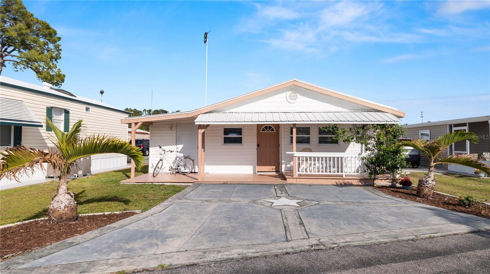 Do you have dreams of easy mornings on your front porch sipping your perfect cup of coffee with a spectacular view of Lake Henry. This great community features a pool, community center that offers community dinners and exciting social activities, shuffleboard courts and a boat slip and fishing on Lake Henry! Take a look at this 3 bedroom, 1.5 bathroom home located in the active 55+ community of Fairview Village! This home has been meticulously maintained and updated with drywall throughout the home giving it a cozy feel. The roof was replaced in 2023 along with new interior paint and the exterior was re-painted in 2025. The AC was replaced in 2017. This home is located conveniently in Winter Haven with easy access to dining, shopping, and major roadways. Arriving at the home, you’ll find a covered front porch, the perfect spot for sipping your morning coffee, with a view of Lake Henry. Inside, you’ll find LVT flooring throughout. The living room is spacious with plenty of natural light. The kitchen/dining area offers plenty of space for entertaining. The primary bedroom offers privacy and is located at the back of the home and provides an en-suite with a stand up shower. The home includes an indoor laundry/storage room and a separate utility room with its own outdoor access. Schedule your private showing today and see all that this home has to offer!