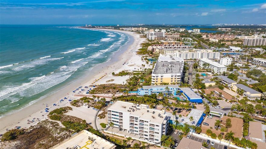GULF FRONT condo on the world-renowned Crescent Beach on Siesta Key! A rare opportunity to own the ONLY 3 bedroom unit in this mid-rise complex on the top floor! This TURN-KEY FURNISHED unit is also one of the highest grossing vacation rental condos with direct beach views of Siesta Key's legendary powdery, light quartz sand and tranquil Gulf waters. This highly desirable 6th floor unit can make an exceptional year-round primary residence, winter retreat or a profitable investment property with a gross rental income of approximately $110,000 in 2023. Featuring expansive and captivating views of the Gulf of Mexico from the living area, master bedroom and 3 private balconies, you will never want to leave! NEW hurricane impact windows and sliders! NEW A/C! NEW roof! With three bedrooms, two full bathrooms and 3 private balconies you and your guests can enjoy the sounds of the waves, the smell of the salt air, the fresh tropical breezes and spectacular sunsets over the Gulf of Mexico.  Unit has its own locked laundry closet (owner's closet) with a stackable washer and dryer that has only been used by owners as rental guests have the ability to utilize the laundry area designated for the 6th floor. One covered parking space is included with alternate areas for guests or second vehicles. There is also a small outside storage unit that is great for beach chairs, umbrellas, pool noodles, fishing gear, paint cans, etc.,   This is a well established vacation rental with strong rental history and high occupancy rates and future bookings. Future bookings and deposits must be honored by new Buyer.  On-site office assists owners as well as management of rentals. This gated resort is the closest condominium to the Point of Rocks area known for its sea life, fishing and snorkeling.  Resort-style amenities include a private beach, two heated pools, WIFI, pool side gazebo, BBQ grills, lounge area, and exercise room. Fantastic location within walking or biking distance of restaurants and shops. The free trolley also affords the opportunity to explore more of the island including checking out Siesta Key Village, its shops and restaurants. Take advantage of this rarely available unit and make it yours today! Bedroom Closet Type: Built In Closet (Primary Bedroom).