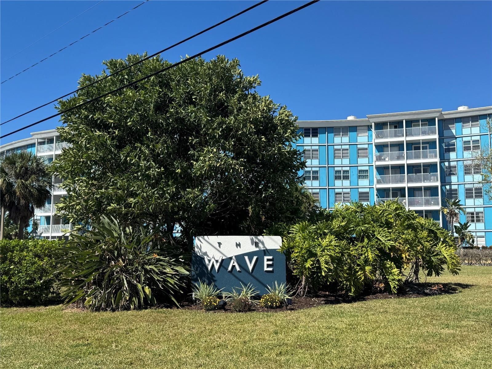 Furnished & Upgraded 1BR / 1.5BA Condo at The Wave! This condo is located in the desirable Wave community. Spacious open-concept floor plan with vinyl flooring throughout living, dining, and kitchen areas. The kitchen features extra-large stainless steel appliances including a side-by-side refrigerator, dishwasher, range, and microwave. Enjoy pool and conservation views from the living area. Primary BR offers two closets, ample storage space, and a private ensuite bath. The Wave is a 6-story Brazilian Art Deco–style building full of charm and character. Community amenities include a fitness center, pool, BBQ area, secure FOB-only building access, and assigned parking conveniently located near the unit and staircase. Excellent location just minutes to I-275, St. Pete Beach, and Downtown St. Petersburg. Close to shopping, dining, banks, and all the activity of the growing Skyway District.