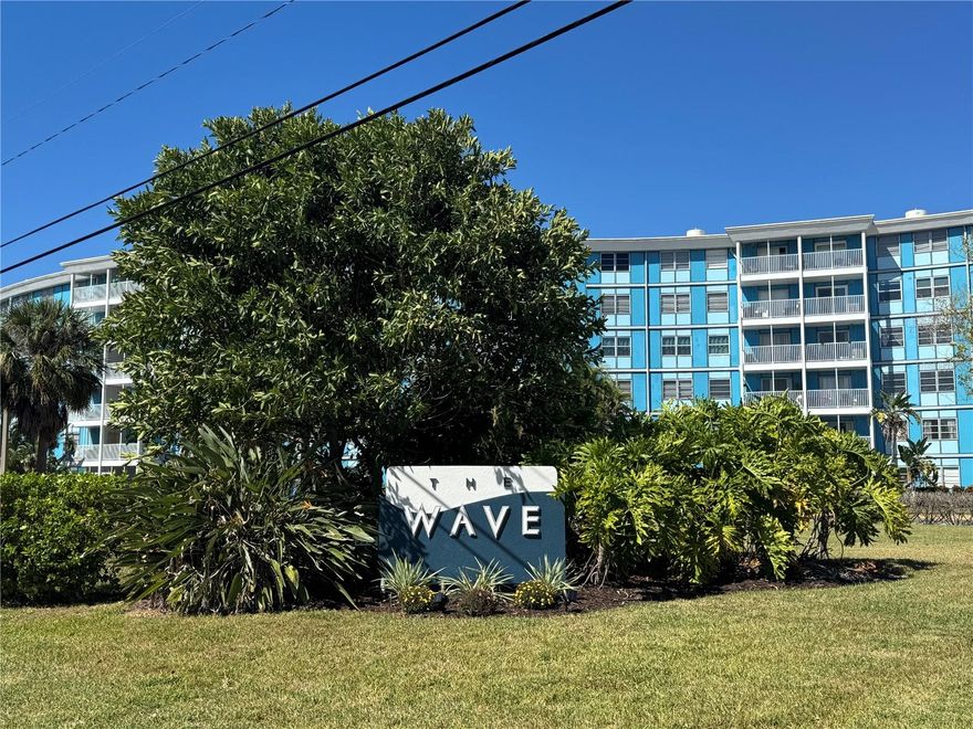 Furnished & Upgraded 1BR / 1.5BA Condo at The Wave! This condo is located in the desirable Wave community. Spacious open-concept floor plan with vinyl flooring throughout living, dining, and kitchen areas. The kitchen features extra-large stainless steel appliances including a side-by-side refrigerator, dishwasher, range, and microwave. Enjoy pool and conservation views from the living area. Primary BR offers two closets, ample storage space, and a private ensuite bath. The Wave is a 6-story Brazilian Art Deco–style building full of charm and character. Community amenities include a fitness center, pool, BBQ area, secure FOB-only building access, and assigned parking conveniently located near the unit and staircase. Excellent location just minutes to I-275, St. Pete Beach, and Downtown St. Petersburg. Close to shopping, dining, banks, and all the activity of the growing Skyway District.