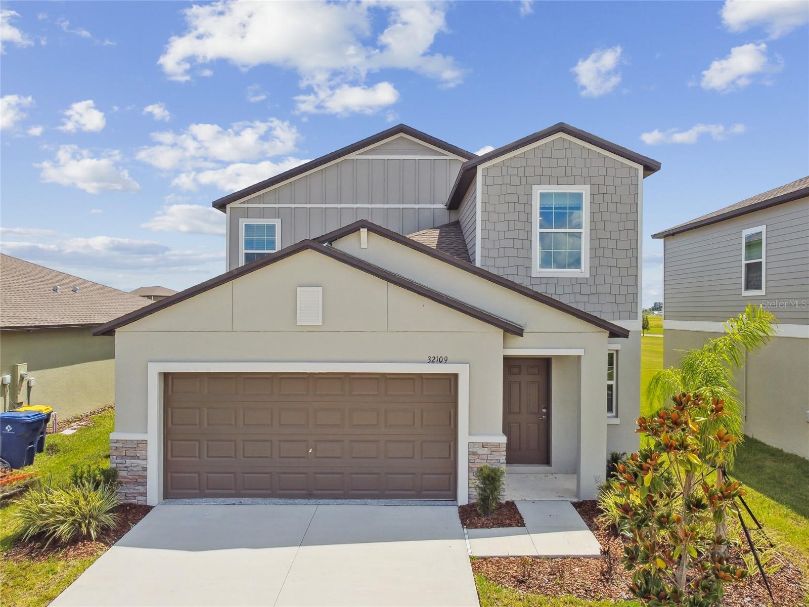 BUILDER MODEL FOR SALE-NEVER LIVED IN-This 2023-built Columbia floor plan offers 5 bedrooms, 2.5 baths, with the PRIMARY SUITE LOCATED ON FIRST FLOOR and four additional bedrooms PLUS LOFT upstairs. Located in the golf cart-friendly, resort-style community of Mirada—home to the nation's largest Metro Lagoon—this former builder model includes upgraded designer finishes, custom accent walls, and decorative touches throughout. Tile flooring spans the main living areas; bedrooms and second floor are carpeted. The open kitchen features a large center island with sink, QUARTZ COUNTERTOPS, walk-in pantry, and modern cabinetry. The primary suite offers a large walk-in closet, dual sink vanity, and walk-in shower. Sliding glass doors open to the backyard for seamless indoor-outdoor living. Built in 2022 with newer roof, HVAC, and water heater for peace of mind. HOA FEE INCLUDES CABLE AND HIGH-SPEED INTERNET. Enjoy Mirada’s crystal-clear Metro Lagoon, walking trails, green spaces, community events, and easy access to I-75, shopping, dining, and entertainment.