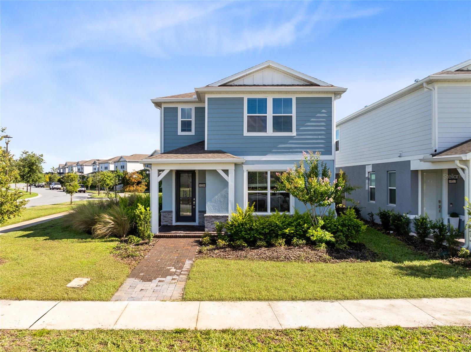 One or more photo(s) has been virtually staged. Premium corner-lot living in Isles of Lake Nona! Positioned on a lot twice the size of a standard bungalow series home, this Pulte-built two-story offers over $60,000 in upgrades, serene water views, and a location that puts the best of Lake Nona right at your doorstep.
Inside, natural light fills the open-concept layout thanks to additional windows throughout. The kitchen is a showpiece with 3 cm quartz counters, upgraded backsplash, 42" upper cabinets with undercabinet lighting, KitchenAid appliances with cabinet covers, and an upgraded faucet. EVP flooring runs through the main level, while LVP stairs with oak handrails lead to the carpeted second floor. The enclosed flex room at the front of the home functions perfectly as a private office, while the loft upstairs offers an inviting space for a media room or sitting area.
The owner’s suite features upgraded cabinetry, a frameless heavy glass shower door, and premium shower fixtures. Other highlights include nickel-finish lighting, LED upgrades, 2" faux wood blinds, glass-inset front door, CAT6 wiring throughout, prewiring for cameras and security, a structured wire enclosure for stronger Wi-Fi, and a video port for cable or satellite.
The rear-entry garage is complete with epoxy floors, extra windows, keypad entry, and a Tesla charger. Enjoy low-maintenance living with lawn care included, plus resort-style amenities—sparkling pool and splash pad, clubhouse, fitness center, tennis, pickleball, and basketball courts.
Just minutes from Medical City, USTA, Orlando International Airport, and top golf and dining, this home blends luxury, function, and location in one of Lake Nona’s most desirable gated communities. Come see why this one stands out—schedule your showing today.