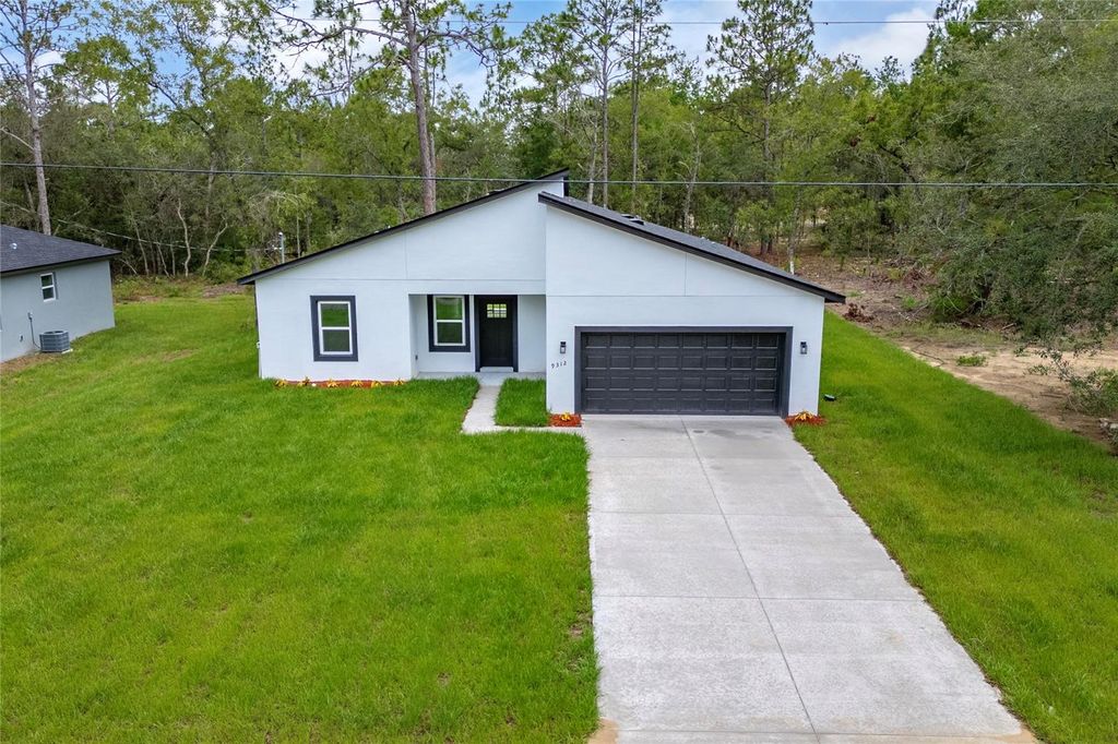 Photo of 9312 N Akola Way, Citrus Springs, FL 34434 (MLS # O6385102)