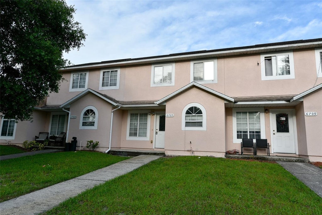 Photo of 6705 Magnolia Pointe Circle, Orlando, FL 32810 (MLS # O6439890)