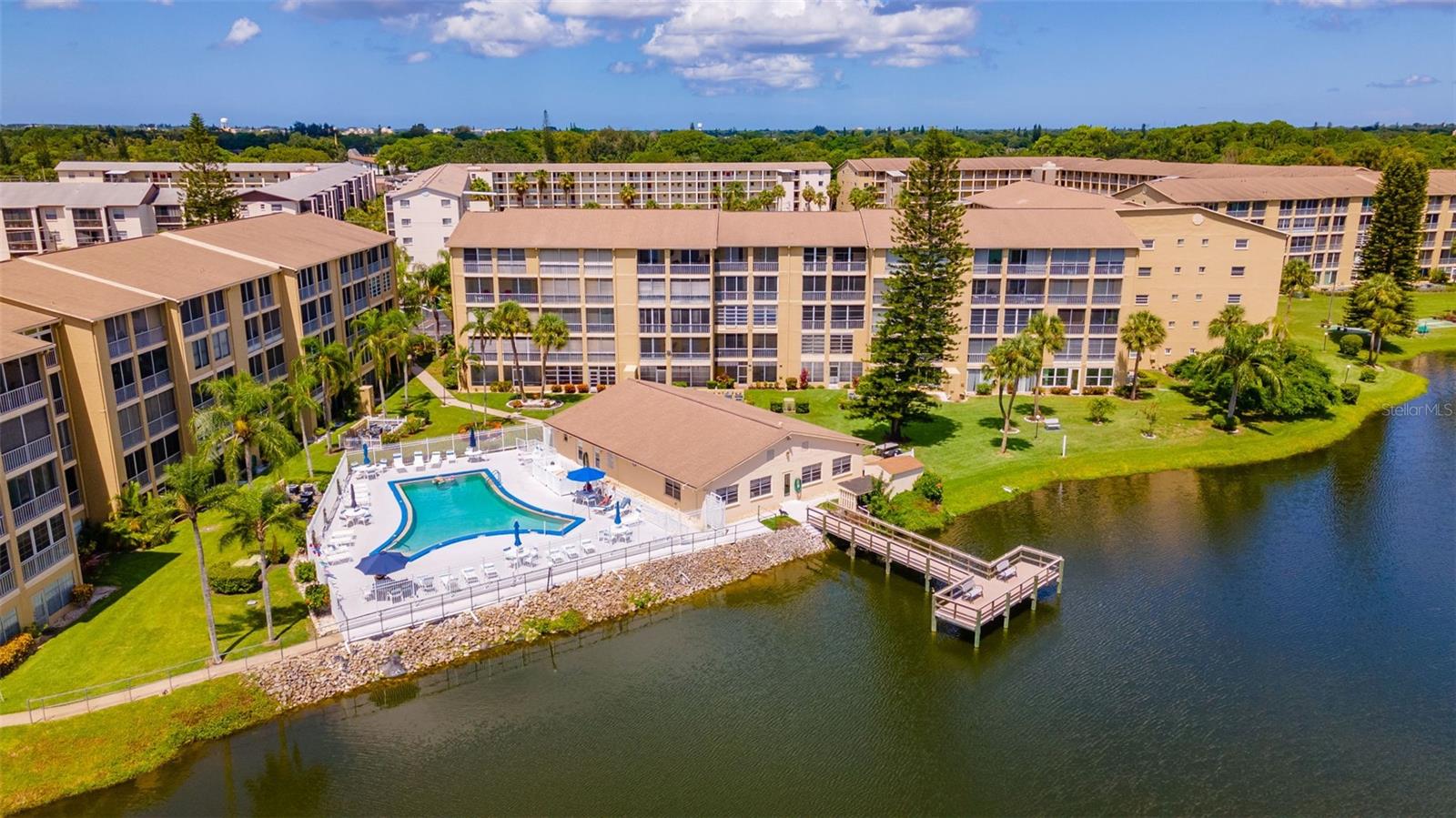 Welcome to Bayshore on the Lake a 55+ condo community!! This 2 bedroom, 2 bath ground level condo with laundry in the unit is ready for its new owners!! Beautiful view of the lake from he lanai where you can enjoy your morning coffee. Lots of recent updates. Kitchen offers a pass through to the dining room. Primary bedroom has its own bathroom with walk in shower. The 2nd bedroom is spacious and and perfect for guests. Enjoy the clubhouse that hosts many different activates, heated pool, fishing pier and shuffleboard. Close to shopping, restaurants, golfing, churches, and beaches. This is one you have been waiting for!! Set up your showing today!!