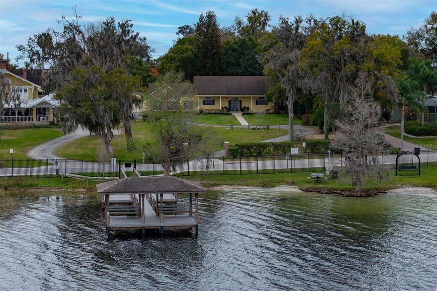 CHARMING LAKEVIEW HOME IN THE HEART OF WINDERMERE! Enjoy unobstructed views of Lake Down from this beautifully located 3-bedroom, 2-bath home in the Town of Windermere. A stunning 44-foot-wide front porch provides the perfect place to relax and take in the peaceful lake scenery, morning sunrises, and evening breezes. Inside, the home offers comfortable living spaces designed for everyday living and entertaining. The backyard provides privacy and mature landscaping perfect for entertaining and family recreational activities! The property also features an impressive 33’ x 23’ oversized garage, providing abundant space for vehicles, storage, a workshop, or recreational gear. Located in the charming and highly sought-after Town of Windermere, residents enjoy a true small-town atmosphere with exceptional local amenities. Stroll or bike to nearby shopping, cozy coffee shops, wine boutiques, and the popular Windermere Brewery. The town also offers a public library, Town Hall, Windermere Police Department, multiple playgrounds, and recreation parks.Windermere is known for its strong sense of community, highlighted by the beloved weekly farmers market and a variety of town-sponsored events held throughout the year.This is a rare opportunity to enjoy lake views, generous space, and the lifestyle that makes Windermere one of Central Florida’s most desirable communities.