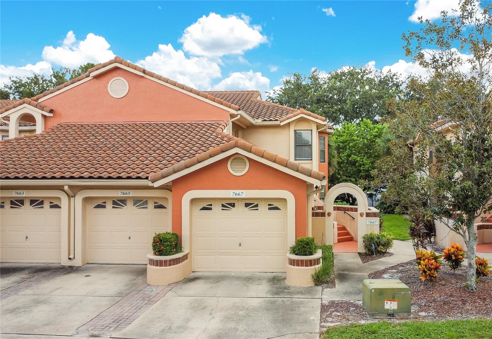 LOCATION, LOCATION, LOCATION! Located in the Dr. Phillips area, this second-floor condo inside the gated Sanctuary at Bay Hill community offers space, style, and convenience. The floor plan features vaulted ceilings, a bright living area, and a screened porch with a private view. Originally designed as a 3-bedroom, it is currently configured as a spacious 2-bedroom with expanded living space. A one-car garage with additional storage adds rare value at this price point. Community amenities include a pool, fitness center, tennis and basketball courts, and a playground. The property is minutes from Restaurant Row on Sand Lake, supermarkets, shopping centers, Universal Orlando, with easy access to Walt Disney World, International Drive, the airport, and major highways (I-4, 528, and 417)