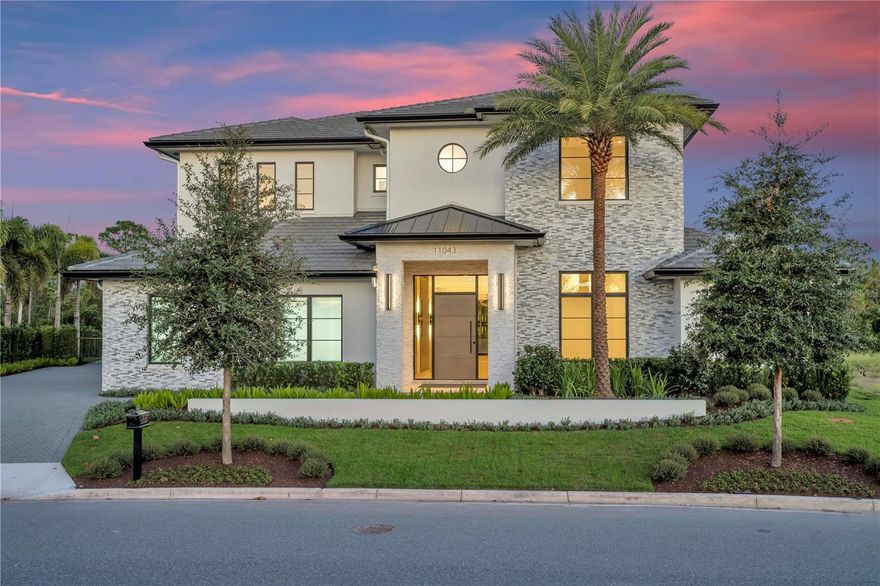 One or more photo(s) has been virtually staged. Expertly built by Maroon Fine Homes, and located in the new Cromwell expansion at Lake Nona Golf & Country Club, this luxurious custom home is perfectly situated with direct access to the Club’s amenity base, The United States Tennis Association’s National Campus, and Lake Nona’s Town Center.

The warm, contemporary residence boasts five bedrooms, five full and two half baths, ranging over an impressive 6,000 sq. ft. floor plan. Custom floor to ceiling millwork, with integrated lighting, and a floating stair case create a stunning entry into the home’s open floor plan. A private, glass enclosed study precedes the large great room, which is set against the serene conservation views, and is anchored by the gorgeous gourmet kitchen and stunning fire place. 

In addition to the first-floor guest suite and sitting room, the main level features the expansive owner’s suite complete with a spa-like primary bath and a 13’ by 26’ custom walk-in closet inspired by a luxury merchandise experience and offering a private vanity.  

The beautiful landscaping highlights all this home has to offer and is the perfect backdrop to the spectacular outdoor oasis complete with multiple covered lanais, a resort-style plunge and lap pool, spa and summer kitchen.  Additional features include a Scullery Kitchen, Second Floor Loft, a Three-Car Garage.
