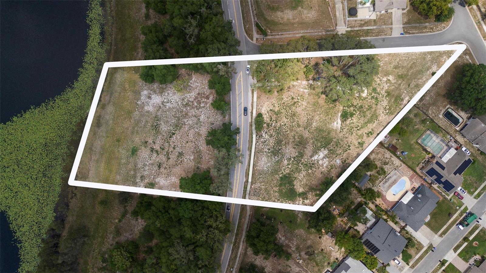 This stunning, almost 3-ACRE property is ready for you to make it your own! **It will be allowed to subdivide the upper land into two and the lower land into two, allowing constructions on the lake—a rare opportunity that significantly expands the property's development potential**Nestled in a highly desirable location, this expansive lot offers endless possibilities for development, investment, or a private retreat. Located on Good Homes Rd, the property provides a peaceful, serene setting while being just minutes from the vibrant heart of Orlando. Surrounded by lush greenery and a tranquil atmosphere, it's the perfect canvas for your next project—whether you're envisioning a custom dream home, residential development, or recreational space. With easy access to major highways, shopping, dining, and attractions, you'll enjoy the perfect balance of privacy and convenience. All that Orlando has to present is just moments away. Don't miss your chance to own a slice of Central Florida's future.