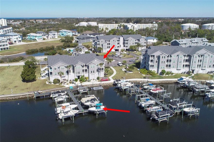 THIS CONDO INCLUDES THE PREMIER SLIP IN THE COMPLEX! DEEDED BOAT SLIP #317 WITH 10K LIFT  JUST MINUTES FROM THE OPEN GULF! For boating enthusiasts, this is the ultimate luxury — launch from your own backyard and be in open water in no time. This light-filled first-floor corner condo offers 2 bedrooms, 2 bathrooms, soaring cathedral ceilings, and beautiful marina and canal views. With two private balconies — one off the living room and one off the primary suite — you can enjoy both peaceful mornings and glowing sunset evenings on the water. Inside, the home is move-in ready and sold fully furnished. Thoughtful updates include new luxury vinyl flooring in the living and dining areas, new tile in the kitchen, new carpet in the primary bedroom, and fresh interior paint throughout. The residence features one beautifully renovated bathroom and a second bath thoughtfully updated, creating a cohesive and well-maintained feel. A rare bonus: this condo includes two private storage rooms — most units in the community have only one — giving you extra space for beach gear, boating equipment, and seasonal items.

As an added extra, a 2001, 21-foot open boat with T-top is included in the sale (see additional remarks regarding condition). The boat has no contributory value and is conveyed as-is.

The community offers true resort-style amenities: two pools, two clubhouses, spa, sauna, tennis courts, community boat ramp, kayak and bike storage, beautifully maintained grounds, and assigned under-building parking. One dog or cat up to 24 lbs is welcome.

Maintenance-free living includes building insurance (flood and wind), roof, exterior maintenance, water, sewer, and trash. Residents also enjoy access to Gulf Harbors Private Beach.

Whether you're searching for a winter retreat, full-time waterfront home, or boating lifestyle upgrade — this is the kind of property that makes buyers say, “This is it.”