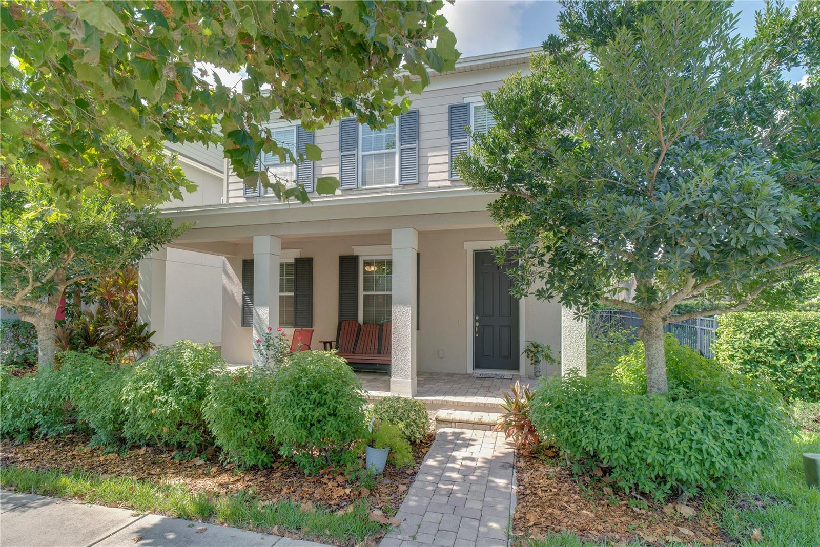 One or more photo(s) has been virtually staged. Welcome to this beautifully maintained one-owner home in the highly sought-after Latham Park community of Winter Garden, ideally located just minutes from Hamlin, top-rated schools, and the 429 expressway. Built in 2018, this charming Celebration-style home offers the perfect blend of modern design, comfort, and convenience. From the covered front porch, enjoy nightly views of the Disney fireworks, or unwind on the spacious covered lanai overlooking your peaceful backyard. Inside, the home boasts a bright, open layout with neutral laminate flooring throughout the main level and cozy Shaw stain-resistant carpet upstairs. The heart of the home is the gourmet kitchen, featuring 42" white cabinetry, sleek white quartz countertops, a large island with modern black fixtures, and Whirlpool stainless steel appliances, including a gas range, refrigerator, microwave, and dishwasher. Upstairs, you'll find all bedrooms, including the spacious primary suite with an ensuite bathroom offering dual sinks, a walk-in shower, and a large walk-in closet. The convenient second-floor laundry room comes complete with a gas washer and dryer. Additional features include: Gas furnace and tankless gas water heater, community pool, fire pit, playground, clubhouse, and 1,000-ft nature preserve boardwalk Perfectly situated near Hamlin Groves Town Center, you'll have easy access to shopping, dining, a luxury movie theater, and the Orlando Health Hospital. And with Disney just 15 minutes away, you'll enjoy the magic from the comfort of your own home.