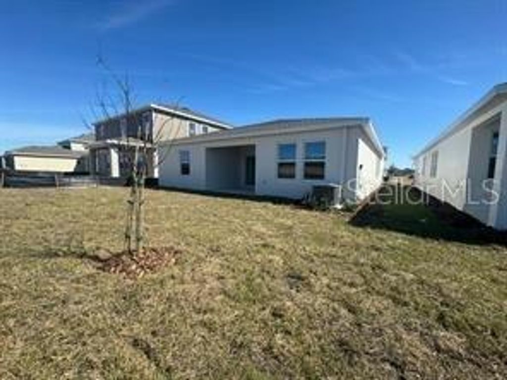 Photo of 2599 Runners Circle #A, Clermont, FL 34714 (MLS # O6400357)