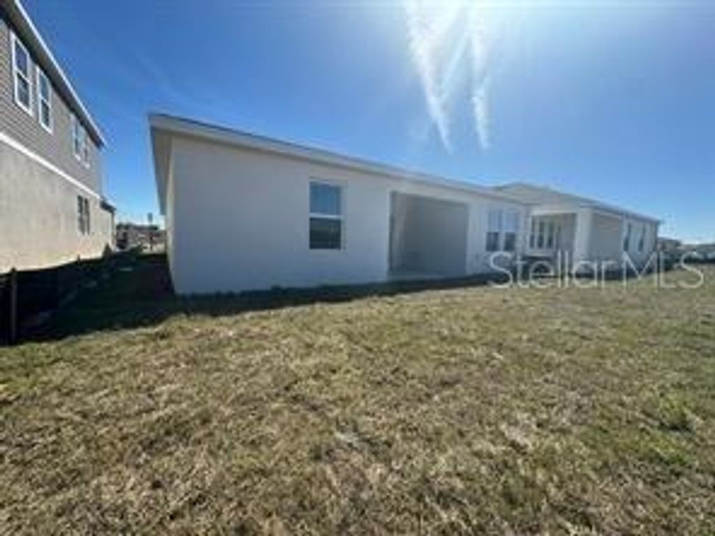 Photo of 2599 Runners Circle #A, Clermont, FL 34714 (MLS # O6400357)
