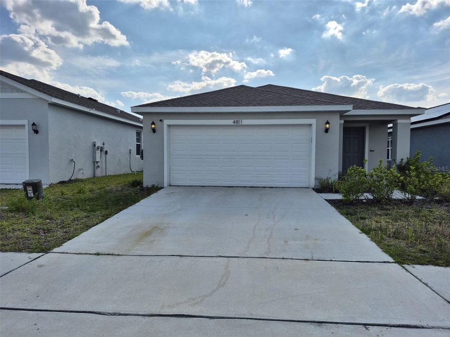 Welcome to 4811 Rigging Street in Haines City, Florida, a well-maintained 3-bedroom, 2-bath home offering 1,319 square feet of comfortable living space. This property features a spacious open-concept layout that connects the living, dining, and kitchen areas, creating a bright and inviting environment ideal for both everyday living and entertaining. The home showcases modern finishes throughout and a thoughtfully designed floor plan that maximizes space and functionality. The kitchen flows seamlessly into the main living area, making it easy to host gatherings or enjoy family time. Additional highlights include a two-car garage and a screened-in back patio, perfect for relaxing outdoors while staying protected from the elements. The backyard space offers a peaceful setting for morning coffee, evening unwinding, or weekend get-togethers. Located in Haines City with convenient access to local shopping, dining, and major roadways, this home combines comfort, style, and practicality