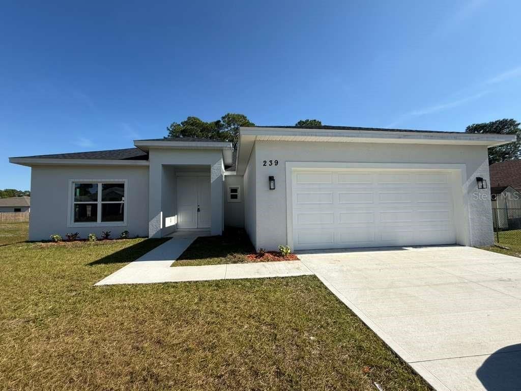 Photo of 286 Catalonia Ave Ave NW, Palm Bay, FL 32907 (MLS # S5122995)