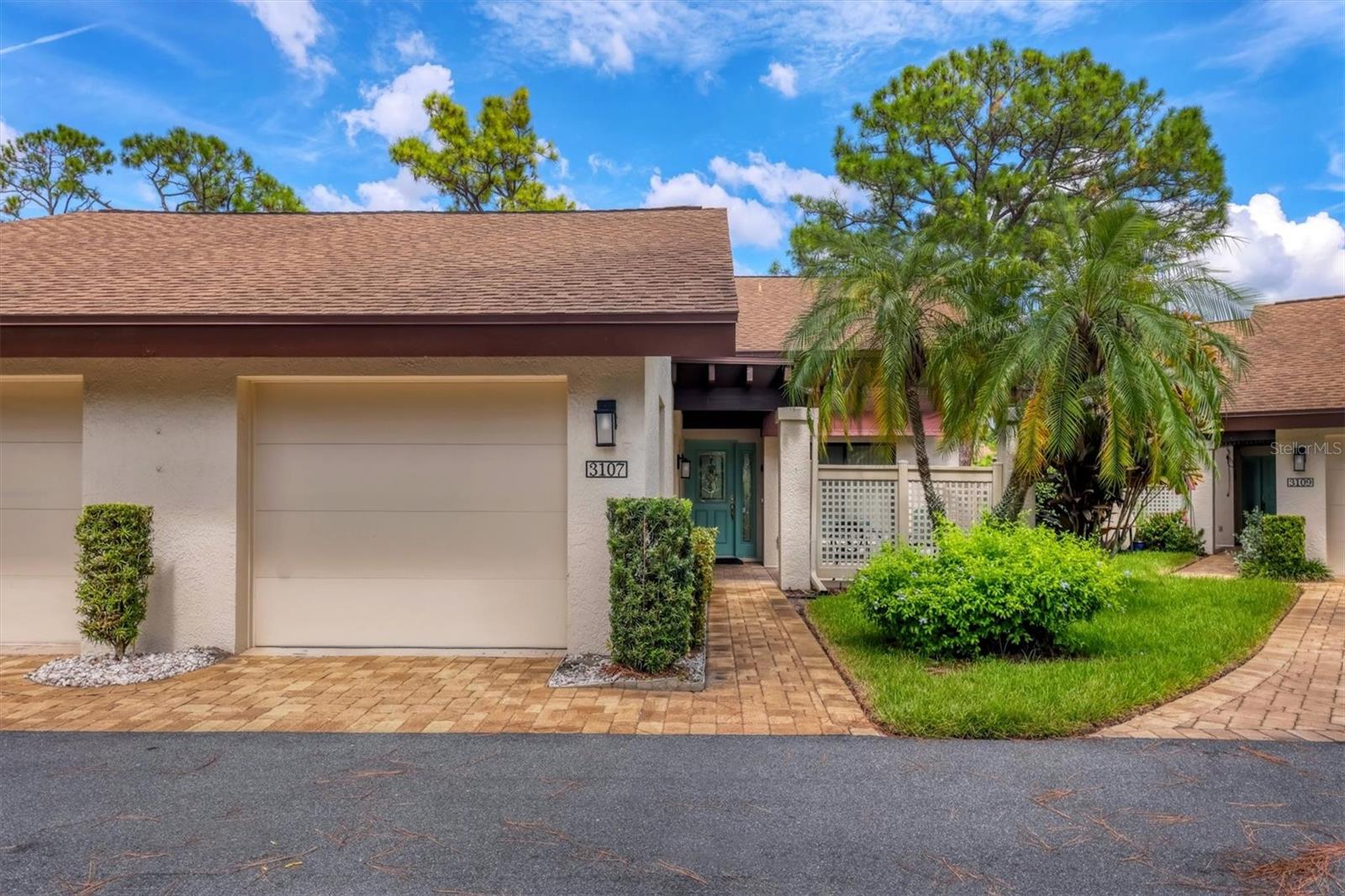 Inviting and maintenance-free, this end-unit villa offers peaceful pond views in The Meadows—one of Sarasota’s most sought-after communities just 15 minutes from downtown. Nestled along a picturesque street with lush landscaping, this home welcomes you with its charming front pergola and attached one-car garage. Inside, the newer neutral paint & carpeting create a warm and welcoming atmosphere. A soaring cathedral ceiling, tall bay window, and sliding glass doors fill the living spaces with natural light while seamlessly connecting the indoors to the outdoors. The kitchen, with is fresh & inviting tone, features durable Corian countertops and direct access to the front pergola—perfect for grilling or enjoying al fresco dining. The spacious primary suite offers a walk-in closet and a well-appointed en-suite bath featuring dual counter-height granite vanities and a step-in shower equipped with supportive handrails for added comfort and safety. The thoughtfully designed guest bathroom enhances accessibility with a raised, handled commode and an easy-access walk-in tub complete with a side-entry door and handheld showerhead—ideal for guests or residents seeking additional support and convenience. A glass-enclosed Florida Room overlooks the pond, where daily birdlife creates a serene backdrop for morning coffee or evening relaxation. Updates include a 2024 A/C system, updated bathrooms, 2018 shingle roof, 2024 repainted interiors, and 2024 new carpeting. Ideally located within 500 feet of two community pools, just one block to the shopping village, and close to all of The Meadows’ amenities, this villa offers exceptional convenience. Life in The Meadows includes 1,650 park-like acres with 14 miles of walking and biking trails. Optional Meadows County Club Memberships available with golfing, tennis courts, and the state-of-the-art Lifestyle & Wellness Center. Beyond the community, you’re minutes from award-winning beaches, cultural attractions, Nathan Benderson Park, and the world-class shopping and dining at University Town Center. This home combines comfort, convenience, and a lifestyle that captures the best of Sarasota living.