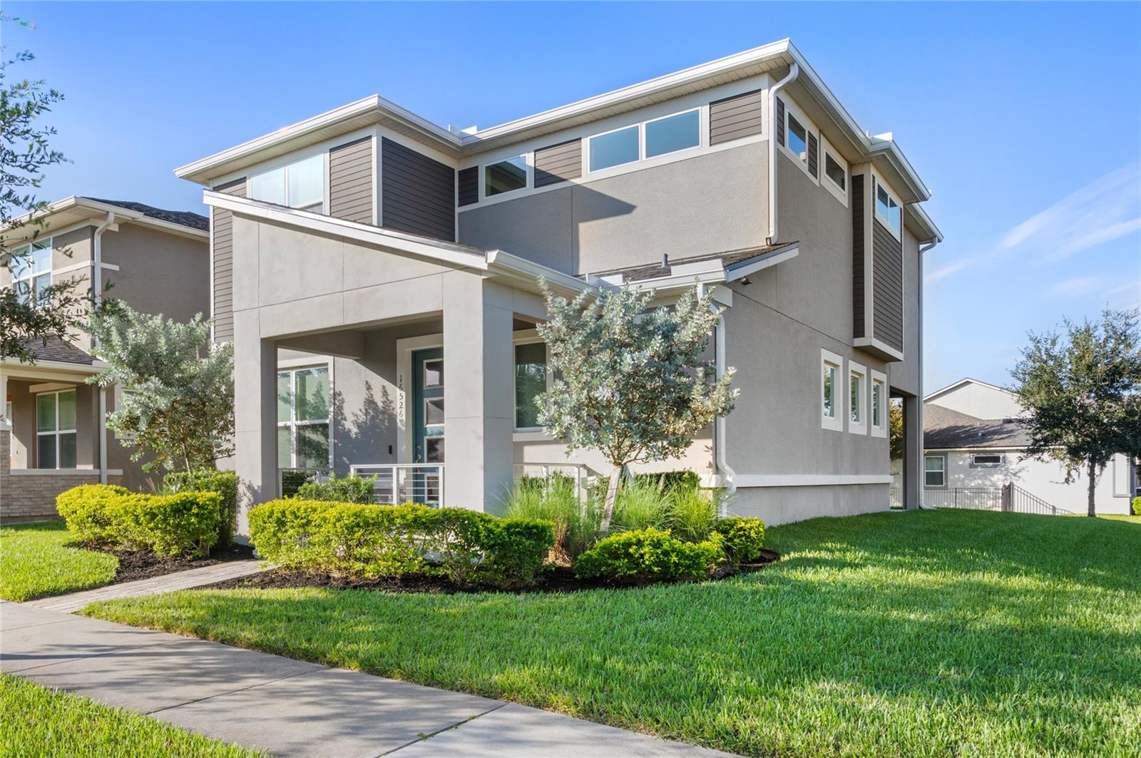 This Layton model features a striking modern exterior and an open-concept first level, designed for both style and function. Featuring 3 bedrooms, 2.1 baths, and a versatile flex room with custom shelving, this home sits on an oversized corner lot in the sought after Hawksmoor neighborhood, just one block from the community amenity with full gym and resort style zero entry pool. The eat in kitchen features a large island, quartz counters, modern upgraded cabinetry, and a walk in pantry, creating the perfect hub for cooking and entertaining. The spacious primary suite serves as a true retreat with an oversized walk in closet, dual sinks, soaking tub with separate shower. Additional thoughtful details include ceiling fans throughout, a water softener, extra storage in the garage, and custom window treatments. Just a short drive to nearby Hamlin Town Center, you will enjoy shopping, dining, and entertainment while still tucked into a quiet community setting. Call for more information or to schedule a private showing.