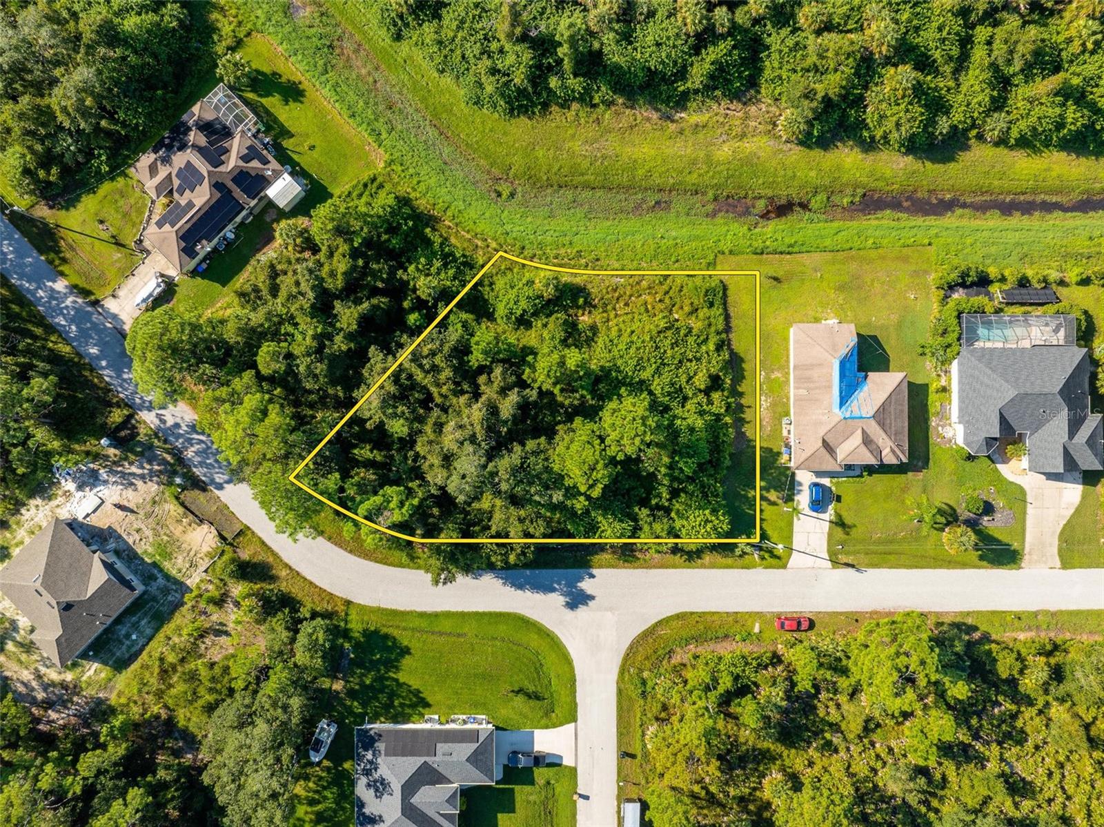 Unique opportunity to own two adjoining oversized lots in the growing area of Sarasota County, surrounded by new construction homes! Located on a quiet street with a serene canal behind, this property is perfect for building your dream home or investment properties. The lots offer a convenient location, less than 3 miles from Warm Mineral Springs Park, 3.5 miles from North Port Aquatic Center, a 15-minute drive to Downtown Wellen Park, and just 30-45 minutes to beautiful Gulf Coast beaches. Enjoy easy access to I-75 and Tamiami Trail, and rest easy knowing these lots are not in a flood zone. Whether you choose to build one large home or separate the lots and build two, this is your chance to create your own piece of paradise in this vibrant and growing neighborhood of beautiful Florida