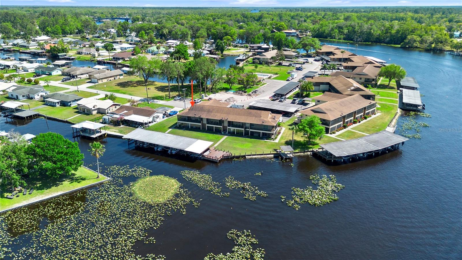 Welcome to Jungle Den, a peaceful riverfront community along the St. Johns River offering scenic walkways, a community pool, clubhouse, shared fishing pier, and beautifully maintained grounds. Just 30–45 minutes from the beaches of Daytona, Ormond, and New Smyrna, and minutes from Blue Creek boat ramp, this location offers a perfect balance of nature, recreation, and accessibility.
This second-floor, fully updated 2-bedroom, 1-bathroom condo includes exclusive use of a private dock, complete with a covered boat slip ideal for boating to nearby restaurants, fishing, or a day trip to Silver Glen. A fish cleaning station is conveniently located on site. Inside, the condo features luxury vinyl flooring, a fully renovated kitchen and bathroom, updated bedrooms, and BRAND NEW HVAC, NEW ENERGY EFFICIENT WINDOWS and a NEW SLIDER DOOR that fills the space with natural light. Breathe easy in this quiet setting surrounded by wildlife and river views. Whether you're seeking a full time residence, peaceful retreat, or investment property, this condo checks every box. The HOA allows rentals with a ONE MONTH MINIMUM RENTAL , providing great potential for seasonal or long term rental income.