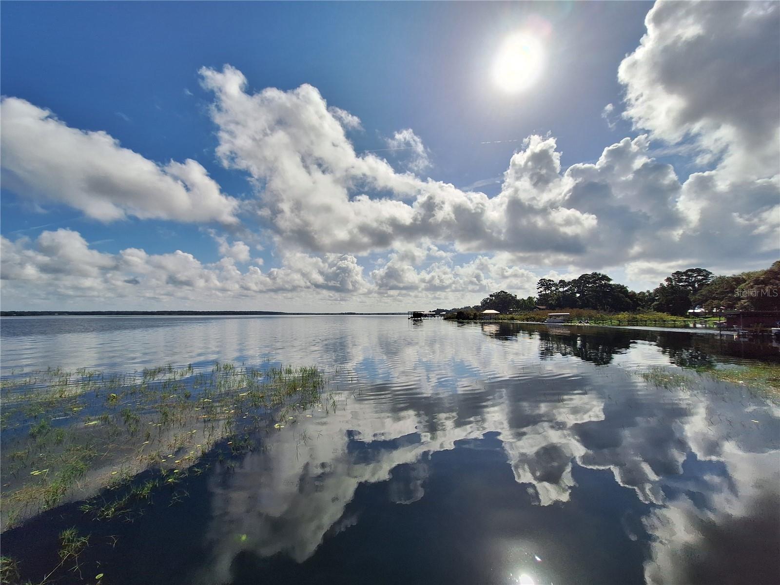 Includes access to Lake Kerr. 4 adjoining lots for a total of .87 acre. Zoned R4 for a house or mobile home. Lot 1 (85'x110') is a corner lot which fronts on NE 213th Ave & NE 135th ST. Lot 2 (85'x110'), lot 3 (85'x110') & lot 4 (90'x110') front on NE 135th ST. Community dock on Lake Kerr is only 200 yards walking distance from this property. (to find the water access from my yard sign drive north on 213th Ave, stay to the left on 213th Ave till you run in to the waters edge at the dock.) There is a public boat ramp/park with bathrooms called Moorehead Park just 2 miles or 5 min drive from this property to launch your boat for the weekend and its free.(The address of the park is 20740 NE 140th ST, Fort MC Coy, you check it out while you are here). The body of water on Lake Kerr consist of approx 9 square miles. Crystal clear water for swimming, boating & jet ski's. It is also well known for its Large mouth bass & Speck fishing. If your into the outdoors and nature this neighborhood adjoins the Ocala National Forest on 3 sides (only a 200ft walk away) giving you access to thousands of public land acres for trail riding, hiking, fishing and hunting, rarely ever having to touch a paved road. The Ocala National Forest also offers outdoor recreational activities such as Juniper, Alexander & Salt Springs for swimming, picnics, boating, campsites and the Florida Trail. Canoe rides on Juniper & Alexander runs.