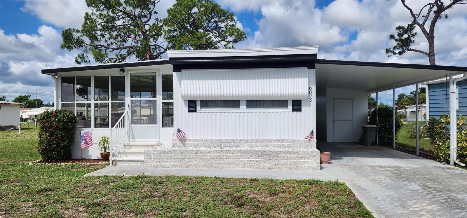 Back on Market... Time to Start Living the Florida Lifestyle Now in this Very Nice - Move-in Ready - Affordable - Partially Furnished 1 Bedroom, 1 Bath Home in a Gated 55+ Community in North Port. Holiday Park Mobile Home Community has plenty to offer including: 2 heated pools, clubhouses, pickleball & tennis courts, shuffleboard, fitness center, library, card rooms, bocce courts, horseshoes, scheduled activities and more.....
Upon entering this adorable home you will see the nice size carport to park your car and built-in storage area and even a place to park a golf cart if you have one...community allows golf carts. This very well maintained home features: vaulted ceiling in living room with ceiling fan overlooking the nice size kitchen with plenty of space for the round dining room table and chairs. All appliances will convey with property. The best room in this home is the Florida room just off the living room....this room has portable a/c system, glass windows all around with awesome views of the great outdoors!! The Primary bedroom is spacious with two wall closets and a built-in desk area. The bathroom has newer walk-in shower with sliding glass doors, one sink vanity and washer in the corner. There is a laundry facility if needed in the community. Other features: 2024 A/C, 2015 Roof, newer rain gutters, newer flooring throughout except in the kitchen, newly painted exterior, new electrical panel box and more...
This is a must see!! There is a greenbelt area behind home to give you some needed privacy.
Great Price!! Great Curb Appeal!! Great Location!! Great Gated Community!!
Nearby shopping, restaurants, parks, golfing, fishing, beaches and more....
Start Living the Florida Lifestyle!! Call today for your private showing before this Affordable Slice of Paradise is Gone!!