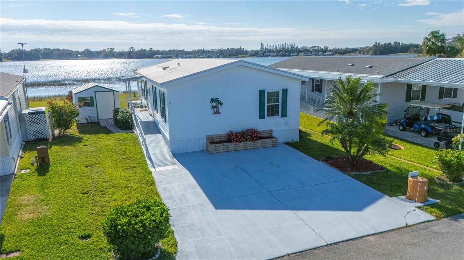 This is the oasis you have been looking for! You have found that Unicorn that you didn't think existed. Fully furnished 2 bedroom 2 full baths. Enjoy the peaceful deck with your morning coffee overlooking the beautiful lakefront that is right outside your door. Walks around the neighborhood will become your favorite thing to do or enjoy a golfcart ride if that is more your style. Whatever you enjoy doing, odds are you will be able to do it in this full amenities community. There is a clubhouse that hosts almost weekly functions along with top notch facilities. From taking a refreshing swim in the sparkling pool, to a vigorous game of tennis or pickleball. Afterwards, grab your fishing rod and walk out of your door down to the beautifully maintained lakeshore and try your hand at fishing. This home is fully furnished with everything you need to make your move in a breeze. Centrally located between Orlando and Tampa, you are close to major metropolitan areas but still enjoy the serenity of the quiet lakefront community that is Saddlebag Lake Resort. Welcome home!