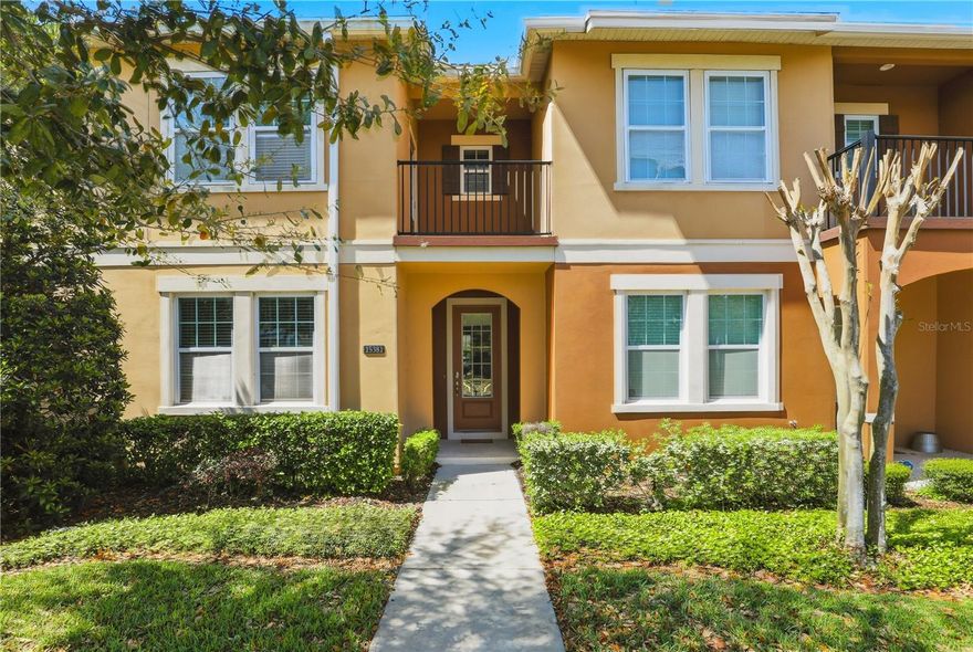 Live in the heart of Hamlin Reserve, this stylish executive townhome sits directly across from the community pool and playground, just a five-minute drive or short distance to Hamlin Town Center for convenient shopping, dining and everyday essentials in Horizon West. Spanning over 2,000 square feet, this four-bedroom, three-bath home with two-car garage and private patio is thoughtfully designed for comfortable, modern living. The main level features an open-concept layout with a guest bedroom and full bath, along with a well-appointed kitchen complete with a large granite island, stainless steel appliances and a spacious pantry, ideal for everyday living and entertaining. A private, partially covered courtyard offers a comfortable outdoor space and leads to an oversized rear-entry two-car garage. The second level features a split floor plan with three bedrooms, two full baths and a laundry room. Relax and unwind in the serene primary suite, complete with a private balcony offering picturesque views of the pool and playground, an ideal vantage point for nightly views of Walt Disney World fireworks. The primary suite also includes an en-suite bath with dual vanities, a glass-enclosed shower and a generously sized walk-in closet. Residents enjoy a maintenance-free lifestyle with HOA-covered exterior care, landscaping, roofing and access to resort-style amenities including a pool, clubhouse, playground, dog park and scenic green spaces, all just near your front door. Positioned near Hamlin Town Center, you’ll experience a vibrant, accessible community with boutique shopping, dining and entertainment, including Cinépolis Luxury Cinemas. With proximity to Orlando Health Horizon West Hospital, Orange County National Golf Center and Horizon West Regional Park, plus easy access to major highways, this home offers a balance of luxury, convenience and lifestyle in one of Central Florida’s sought-after communities. A 2016 roof (HOA maintains), 2016 air conditioner and 2026 water heater.