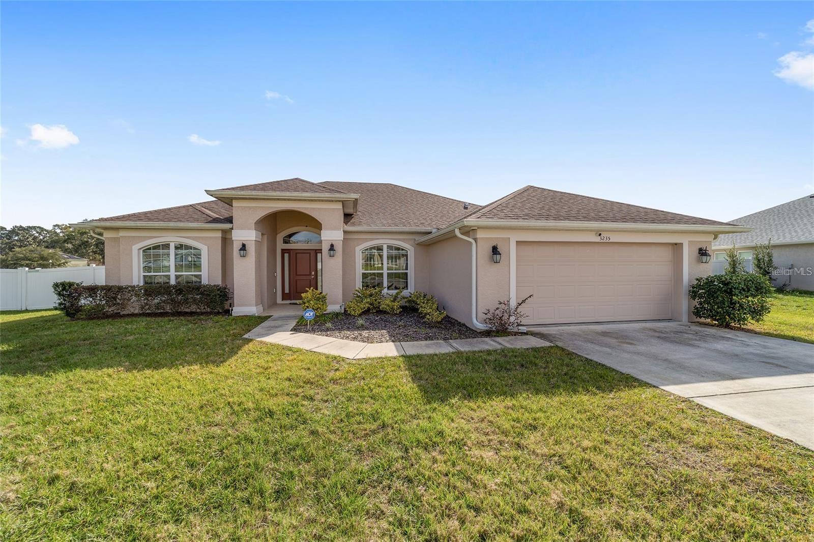 Seller Offering Closing Cost Assistance – Move-In Ready Dream Home! Why wait months for new construction when you can own
this stunning, nearly new home today? Nestled in one of Ocala’s most sought-after gated communities, this 4-bedroom, 2-bath
beauty sits on an oversized 1/3-acre lot and is packed with upgrades! Located in prime SE Ocala, you’re close to top-rated schools,
hospitals, shopping, and dining. The spacious split floor plan offers privacy and comfort for the whole family. The luxurious owner’s
suite features a tray ceiling, his-and-hers closets, and a spa-like ensuite bath. The gourmet kitchen and vaulted ceilings create the perfect setting for everyday living. The fully fenced yard is ideal for families and pets to enjoy safely. The home also has an exceptionally long driveway for all your toys or extra vehicles. Additional features include a sprinkler system, water softener, and security cameras for added peace of mind. The covered patio is the perfect spot to enjoy your morning coffee or unwind with breathtaking Florida sunsets. This immaculately maintained home is move-in ready and waiting for YOU! Don’t miss out—schedule your private tour today!