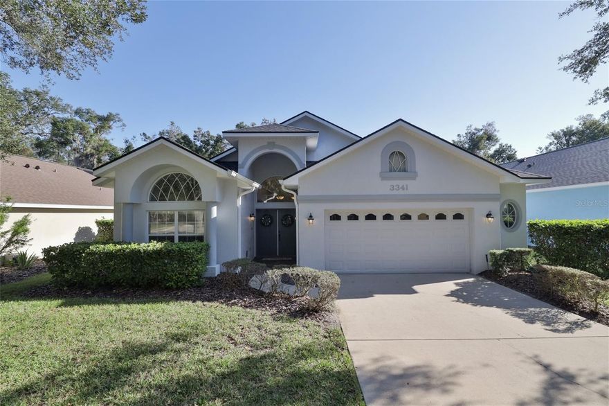 You couldn’t ask for a better place to live than this sought-after community, where the scenic drive to Whisper Glen takes you through The Loop beneath a canopy of majestic oaks. Arrive at your destination and be greeted by stately double doors opening into a tiled entryway and a bright, spacious living room.
Italian tile flows throughout, complementing the neutral color palette and natural light streaming through a wall of sliders and transom windows. The Chef’s Kitchen has been beautifully updated with sleek gray-and-white granite counters, a deep single-basin sink, stainless steel appliances (2020), glass backsplash, under-cabinet lighting, and crisp white cabinetry. A breakfast bar and café nook overlook the peaceful, tree-lined backyard.
Your Owner’s Retreat features a private bath with dual sinks, a walk-in shower, and a relaxing garden tub. The split-bedroom layout ensures privacy for visiting guests, while one guest room with double doors offers the perfect spot for a home office or TV room. Just off the kitchen, the formal dining room is ideal for family gatherings.
Practicality meets convenience with an inside laundry area that accommodates front-load machines and offers built-in shelving. Car enthusiasts will love the oversized garage with abundant cabinetry, a walk-in attic with ample storage, and room for two full-size vehicles plus motorcycles, a golf cart, or other toys.
Step outside to the huge screened lanai, the perfect place to savor your morning coffee while enjoying serene, wooded views. Additional highlights include a premium WKL shingle roof (2018), sprinkler system, and well-maintained landscaping by the Whisper Glen sub-association. (Refrigerator does not convey.)
Halifax Plantation is more than a neighborhood—it’s a lifestyle. Enjoy golf, tennis, fitness facilities, a pro shop, clubhouse, and restaurant, all just a short walk away.
